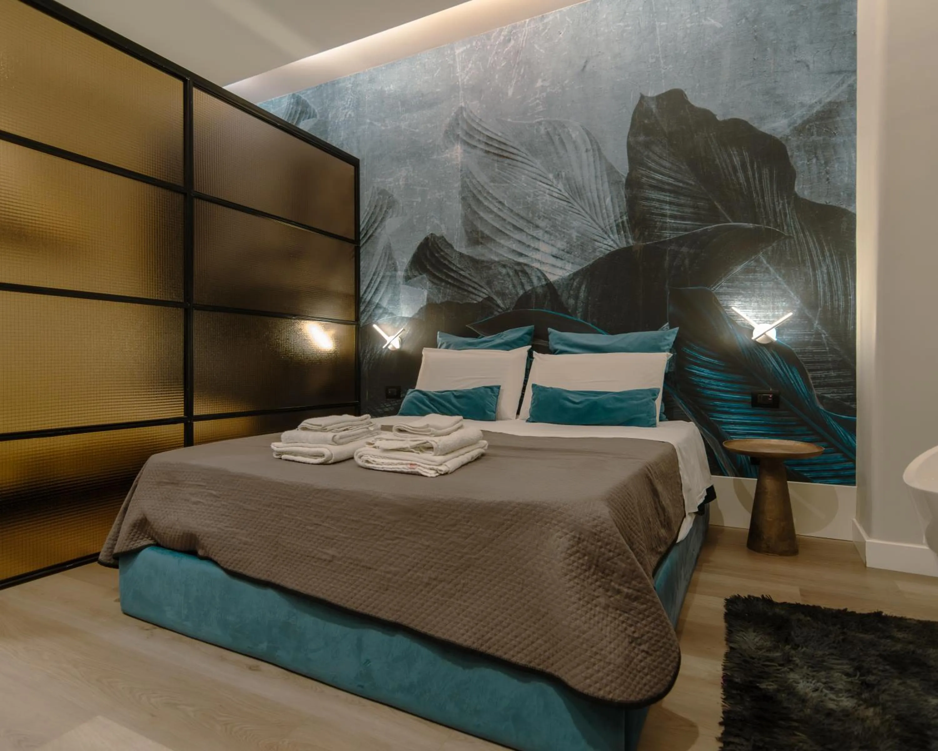 Bed in VESUVIANUS Rooms and More