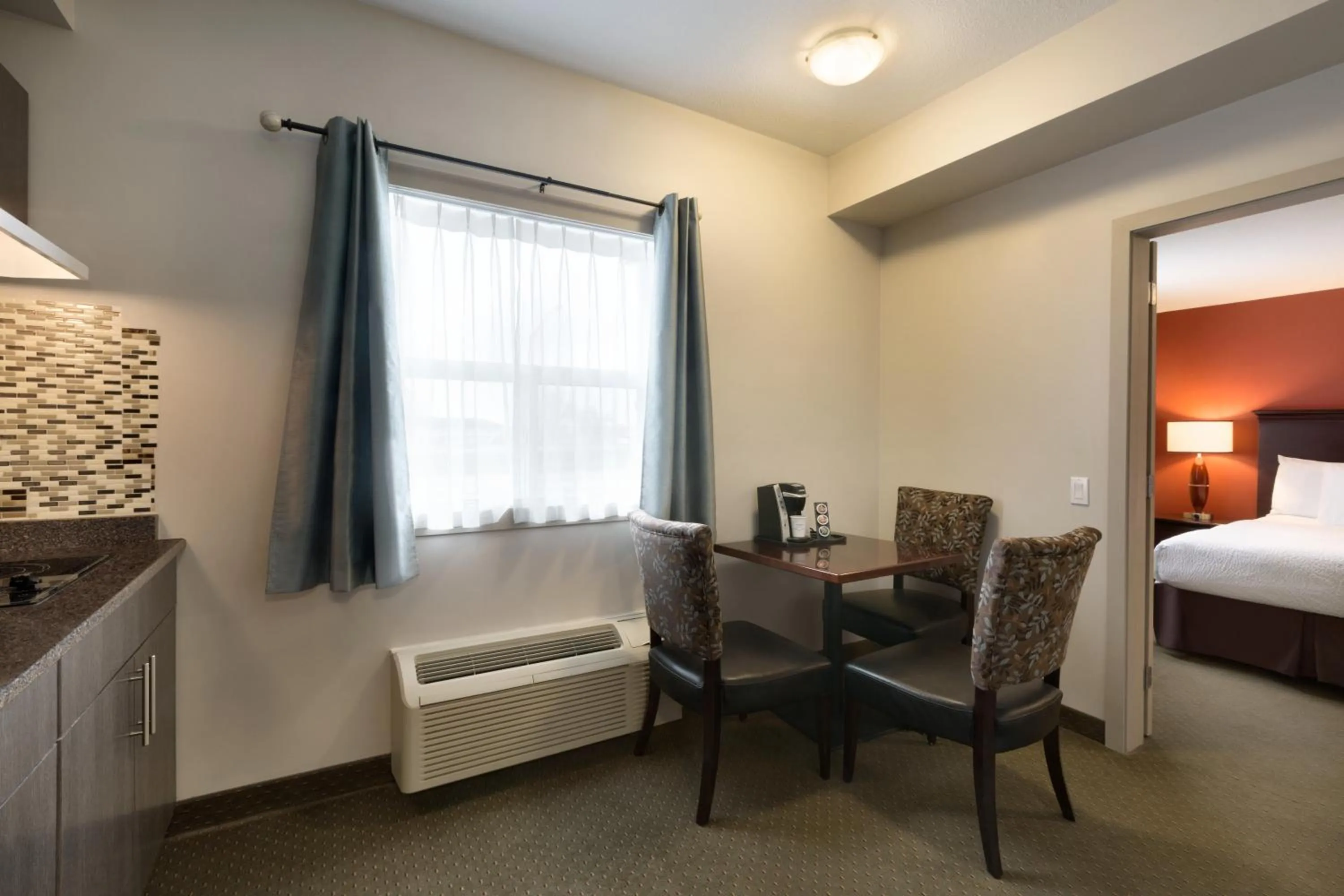 Seating area, Bed in Travelodge by Wyndham Kindersley