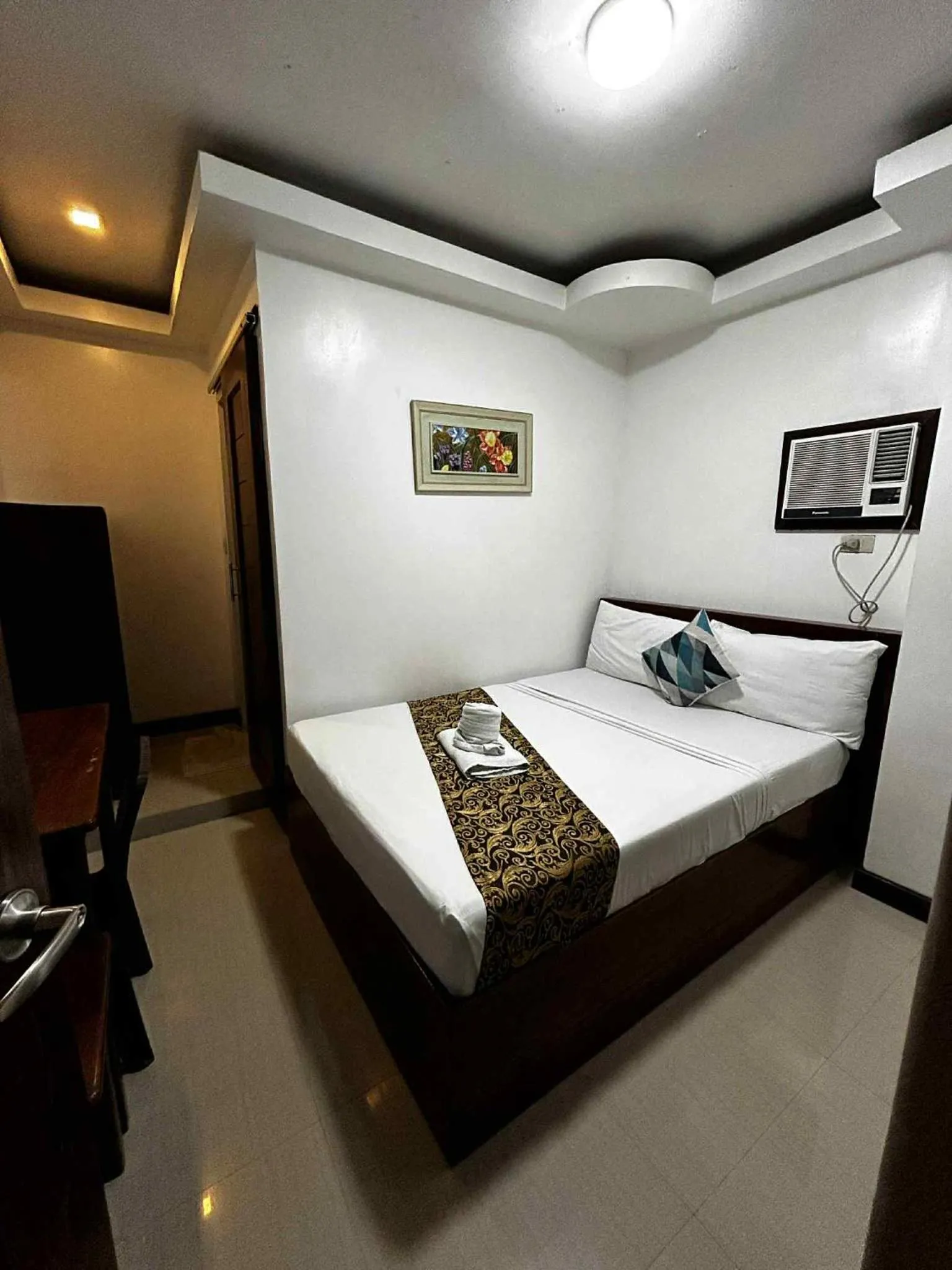 Bed in El Nido Royal Palm Inn