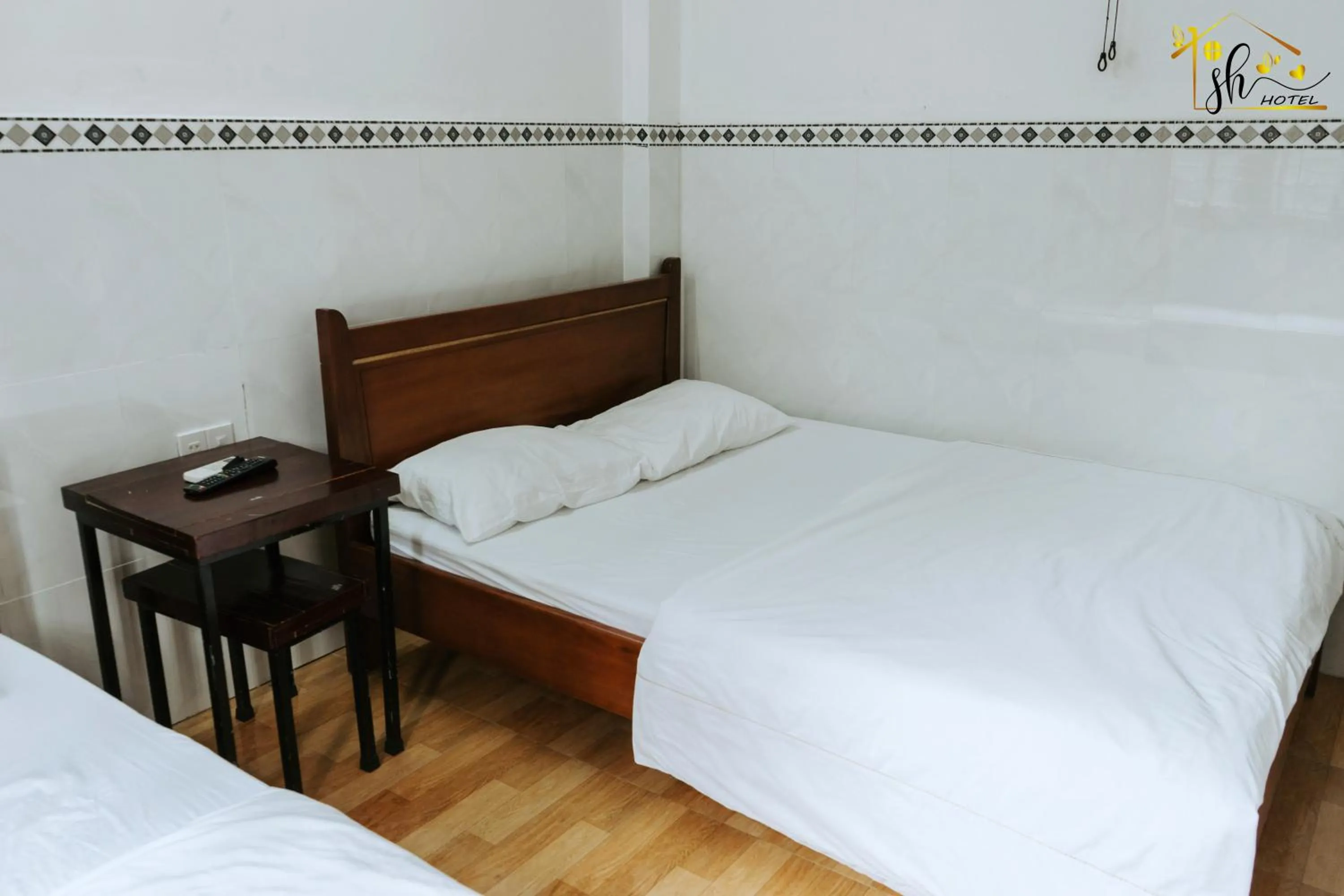 Bed in SH Hotel & Luggage storage