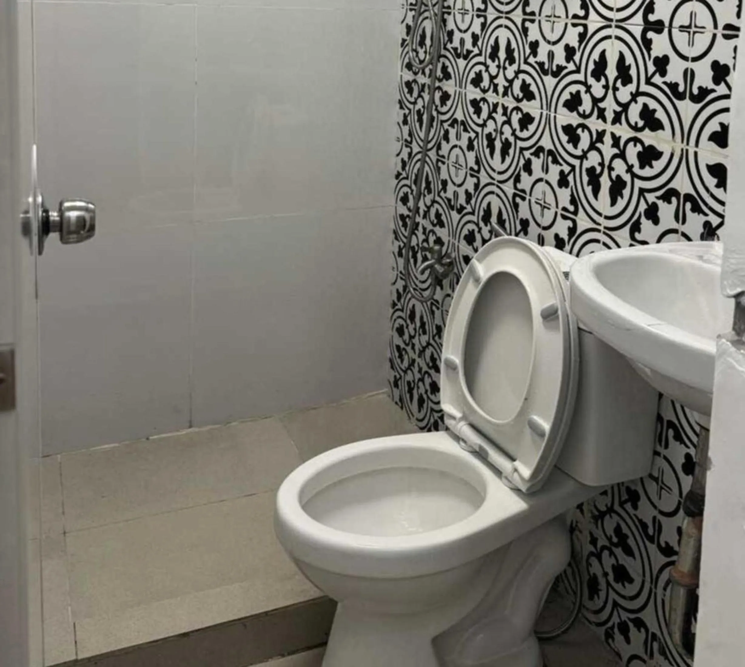 Bathroom in OYO 1155 Carnivale Inn