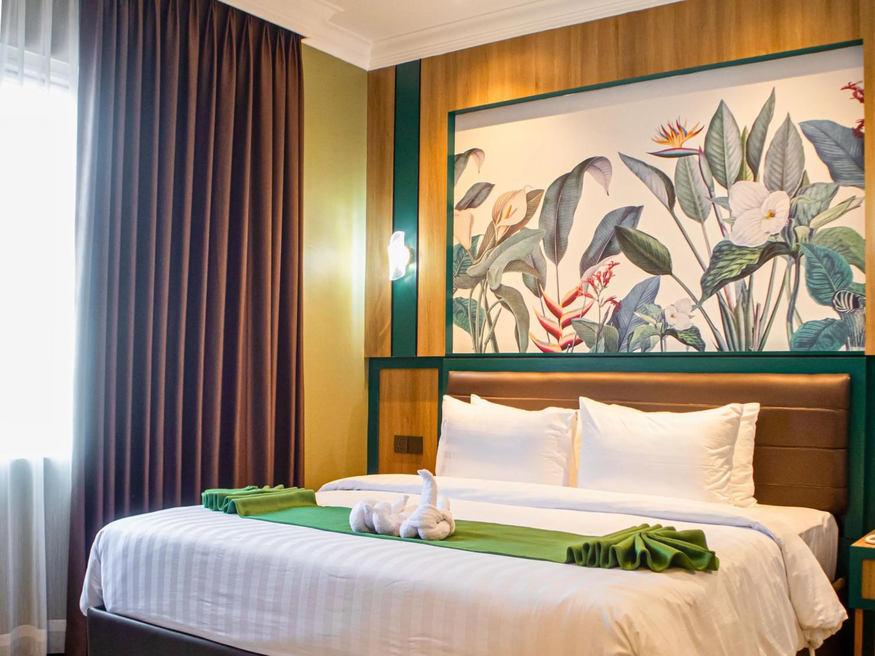 Bed in Bona Ventura Hotel & Skybar