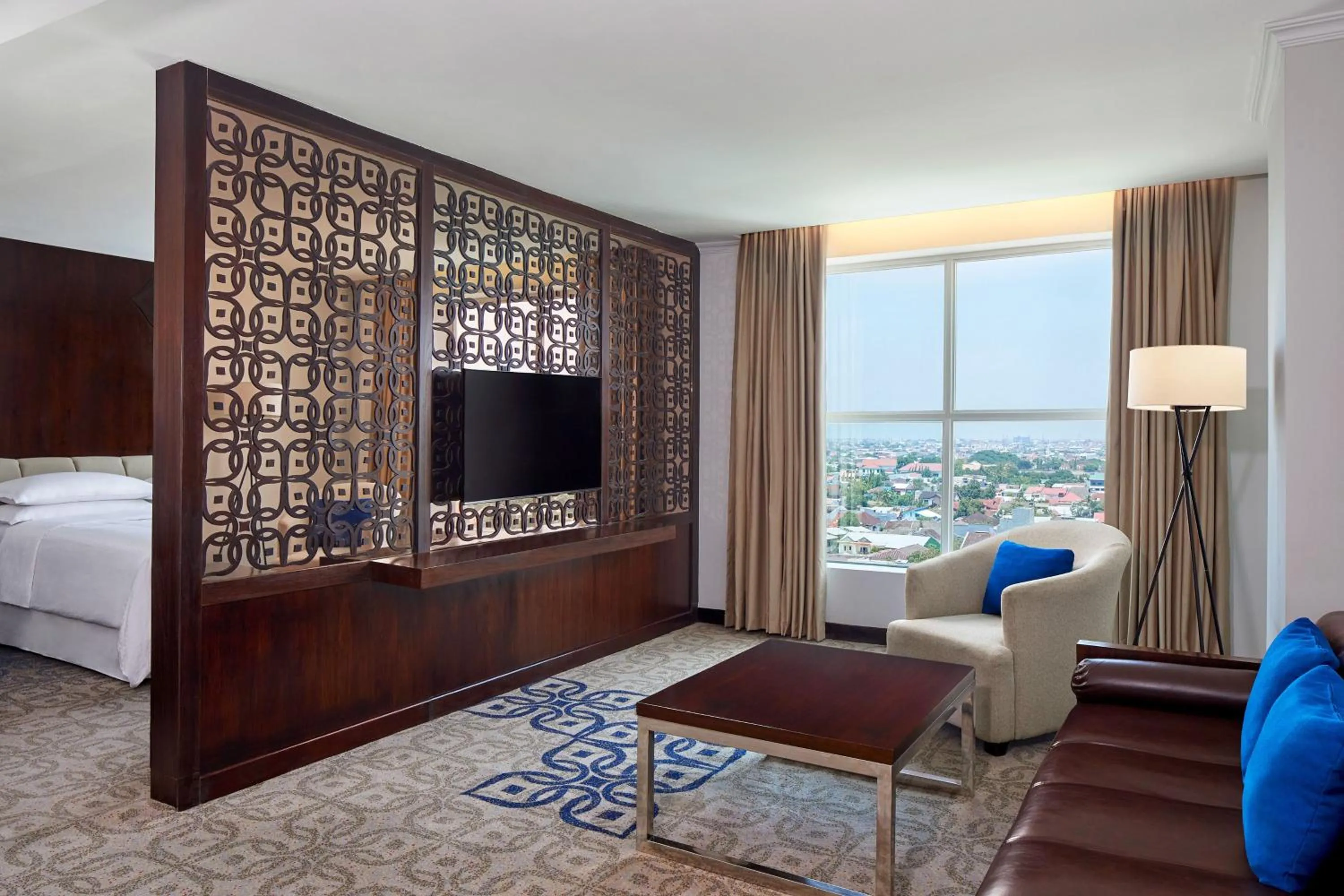 Living room, Bed in Four Points by Sheraton Makassar