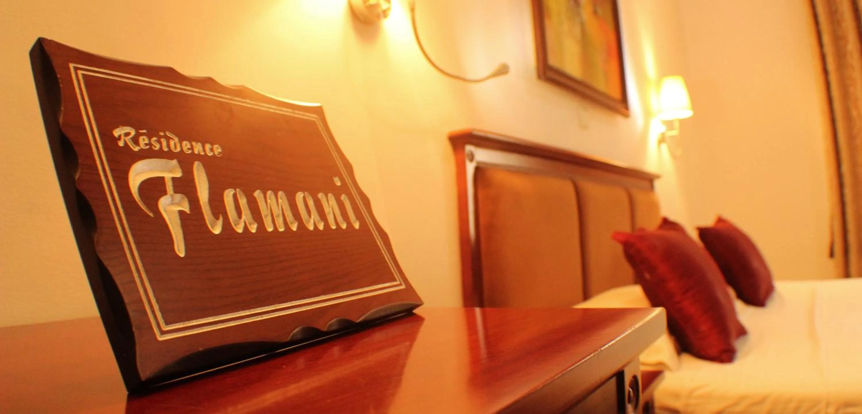 Bedroom in Hotel Residence Flamani