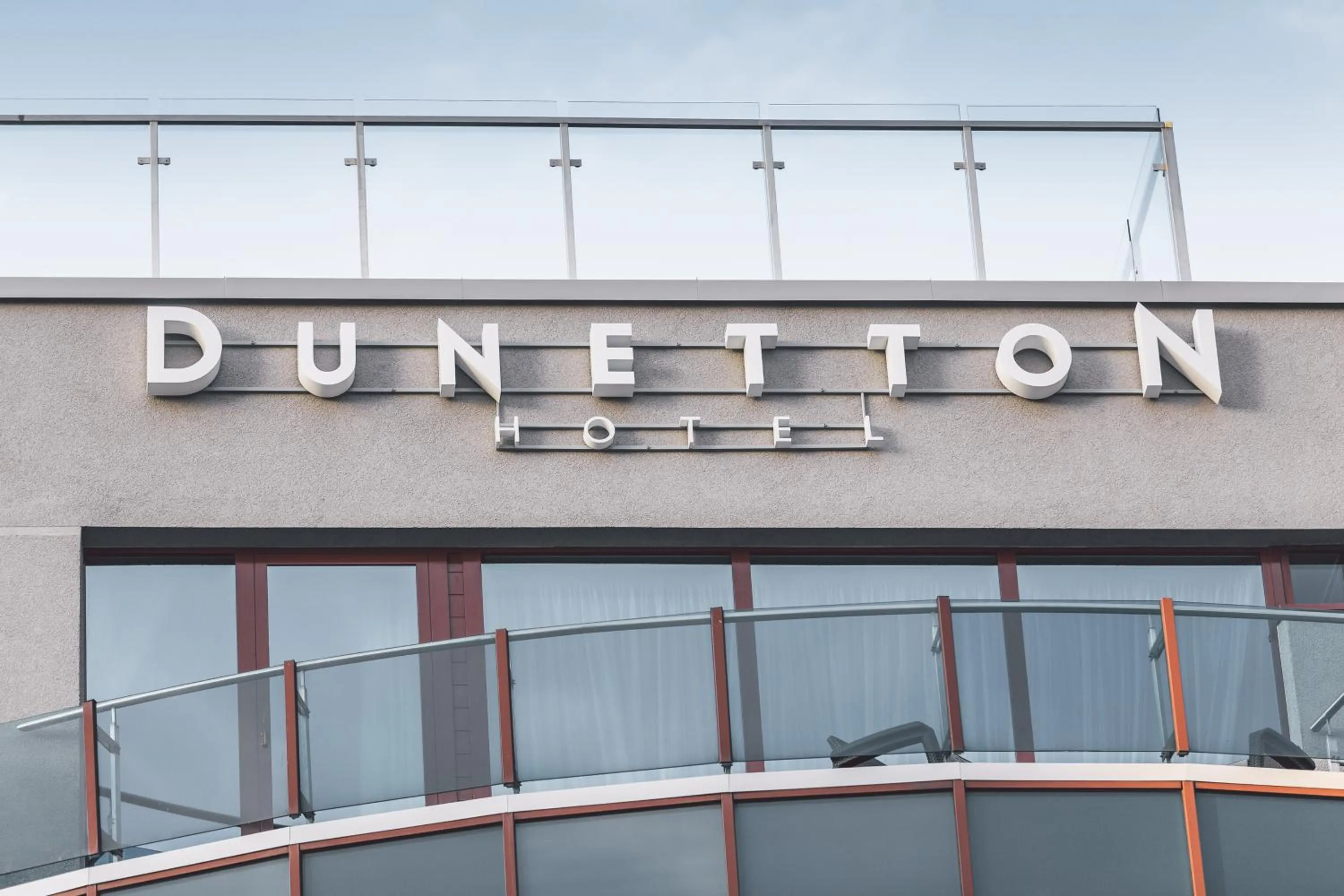 Property logo or sign in Dunetton - self check-in hotel