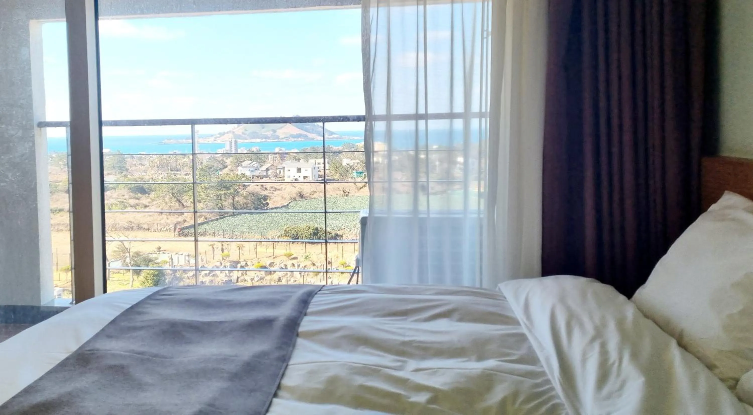 Bed in Hi Jeju Hotel