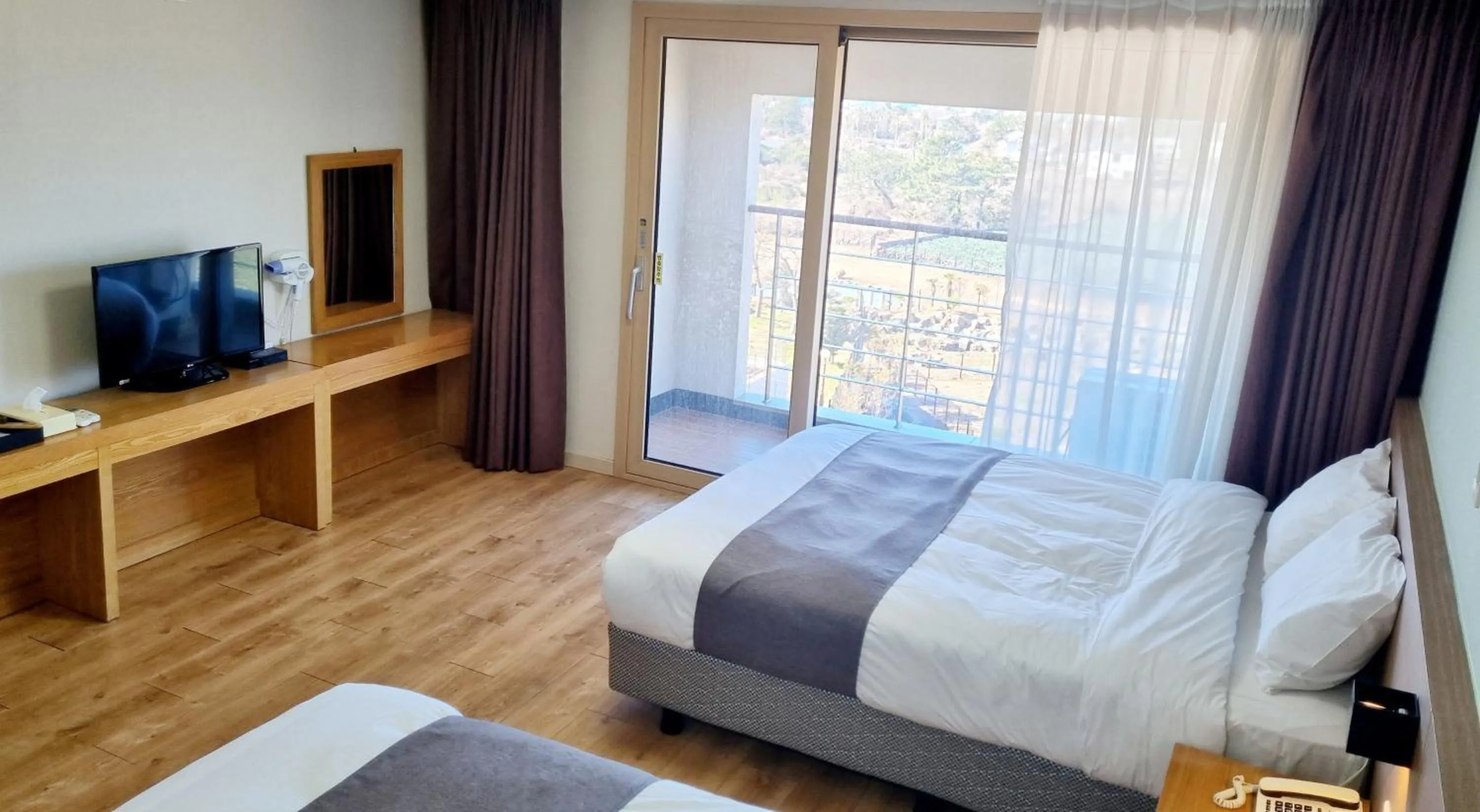 Bed in Hi Jeju Hotel