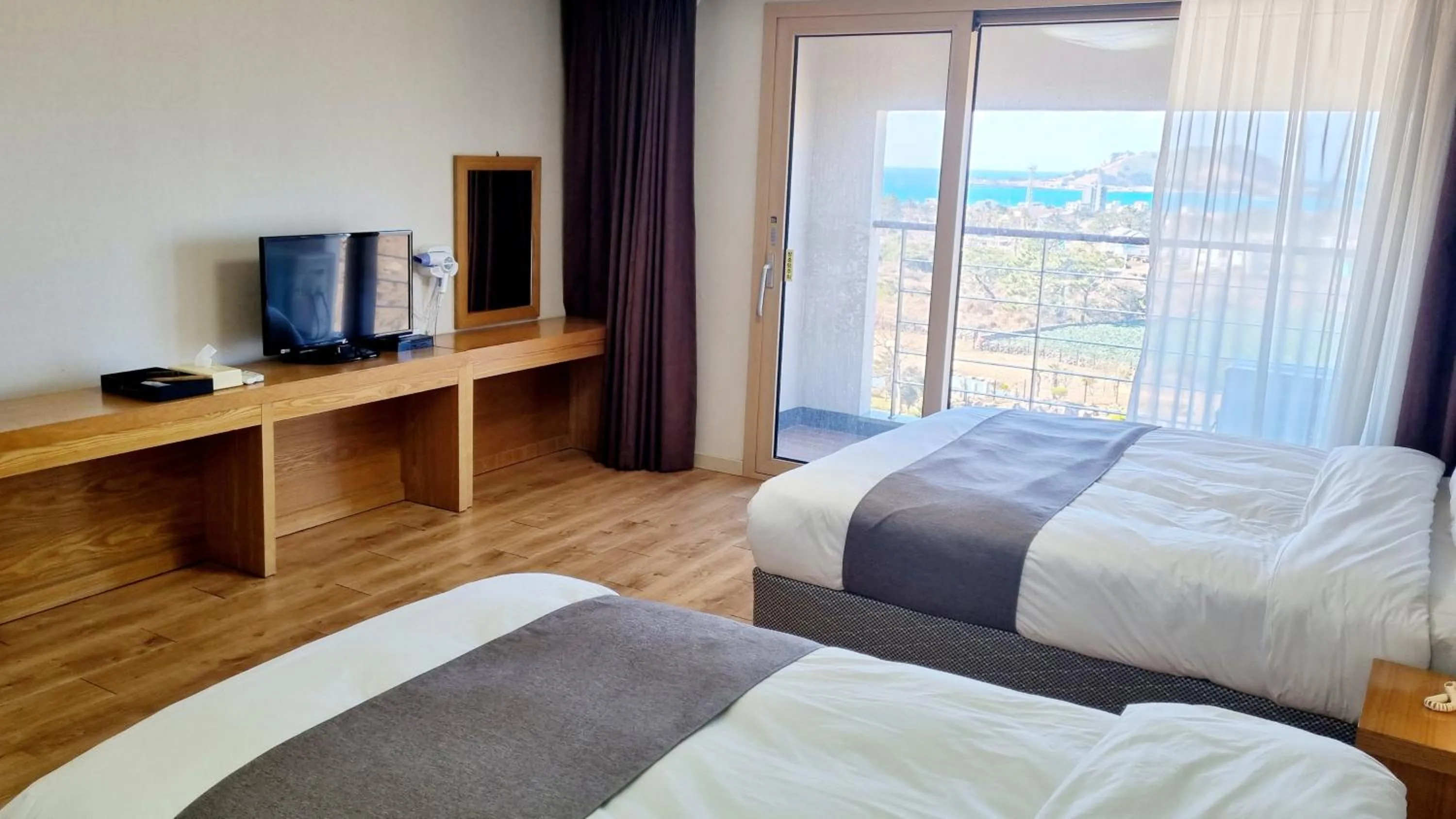 Bed in Hi Jeju Hotel