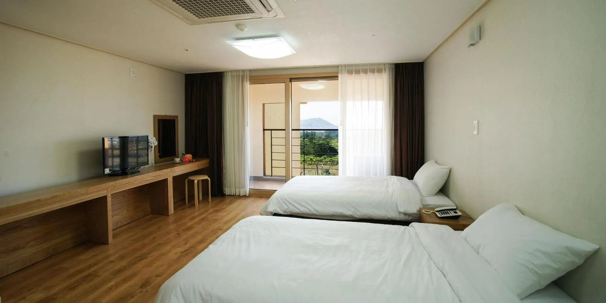 Bed in Hi Jeju Hotel