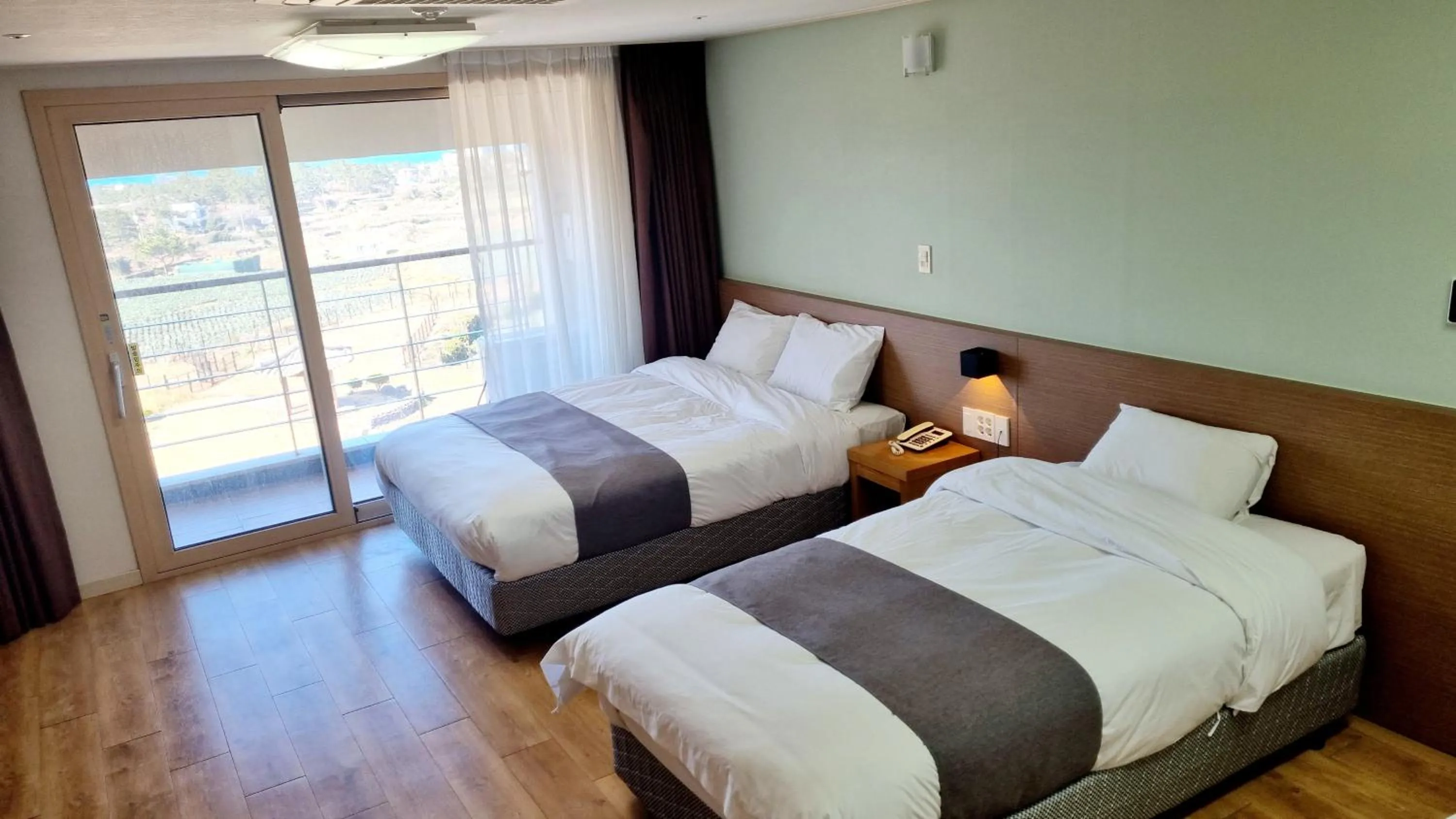 Bed in Hi Jeju Hotel