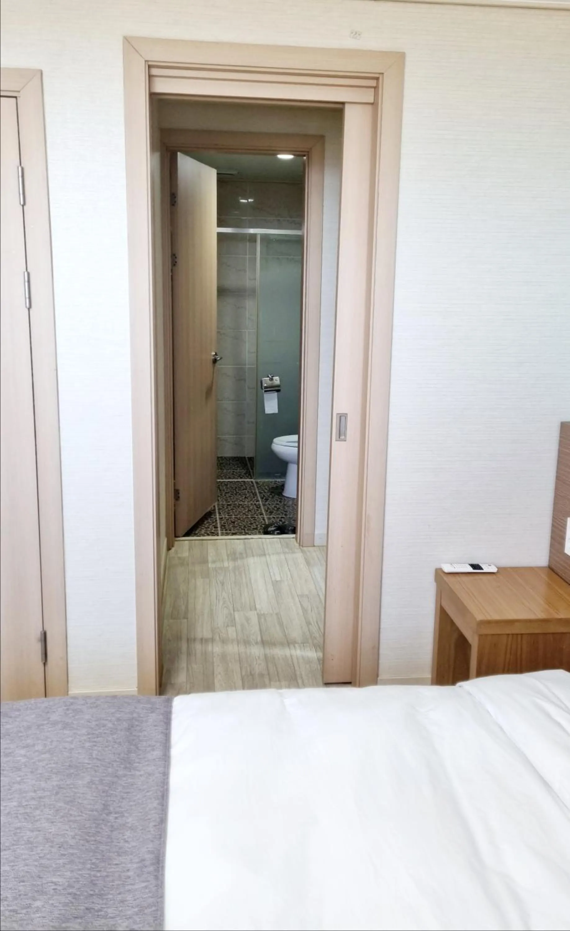 Bed in Hi Jeju Hotel