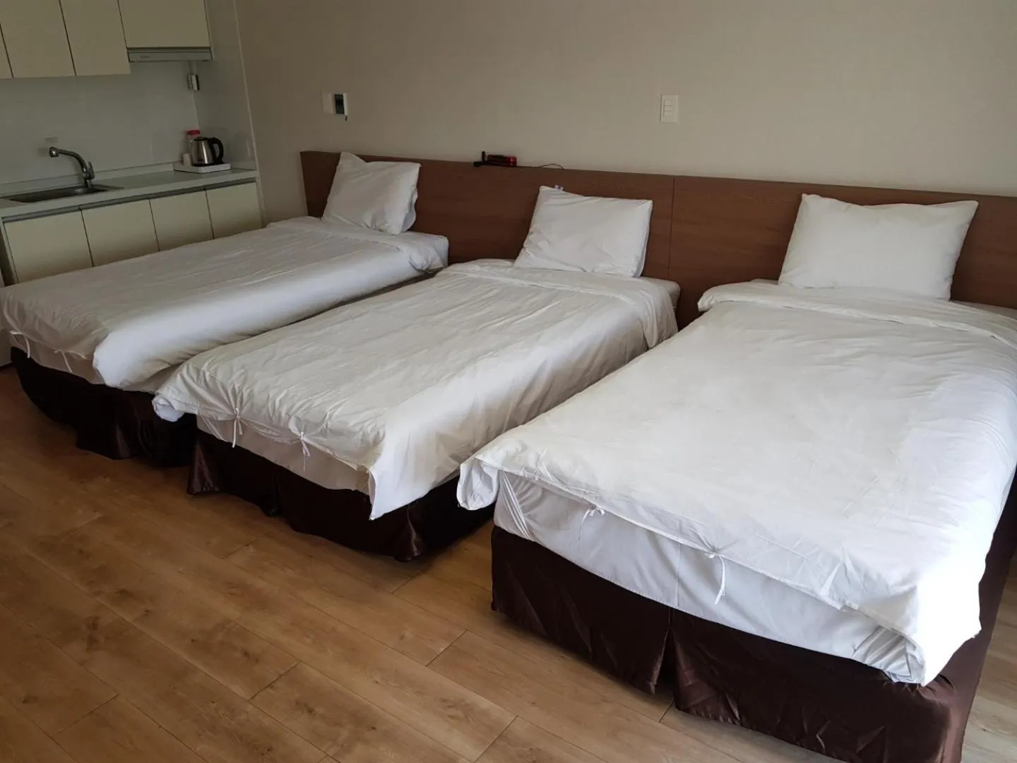 Bed in Hi Jeju Hotel