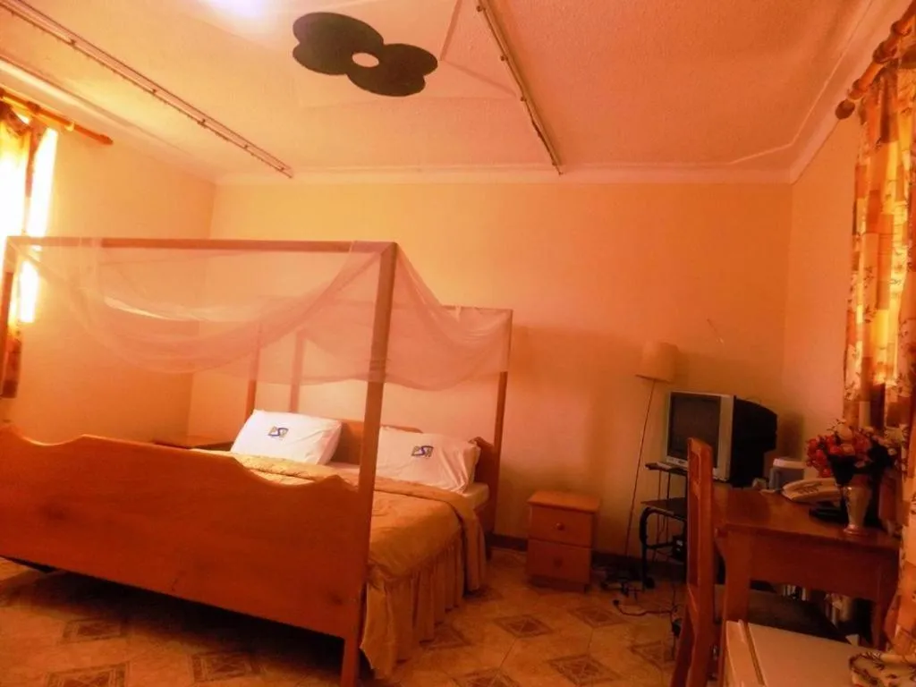 Bed in Palm Springs Hotel Masaka