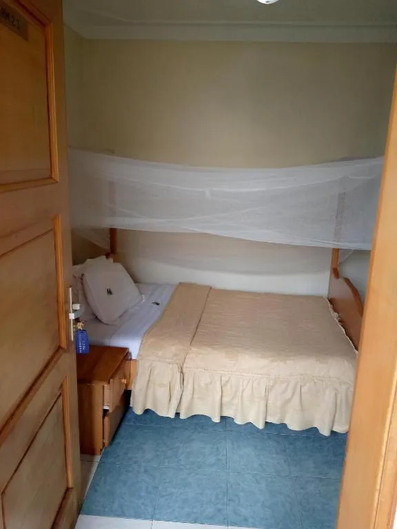 Bed in Palm Springs Hotel Masaka