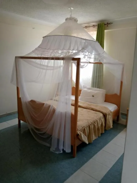 Bed in Palm Springs Hotel Masaka