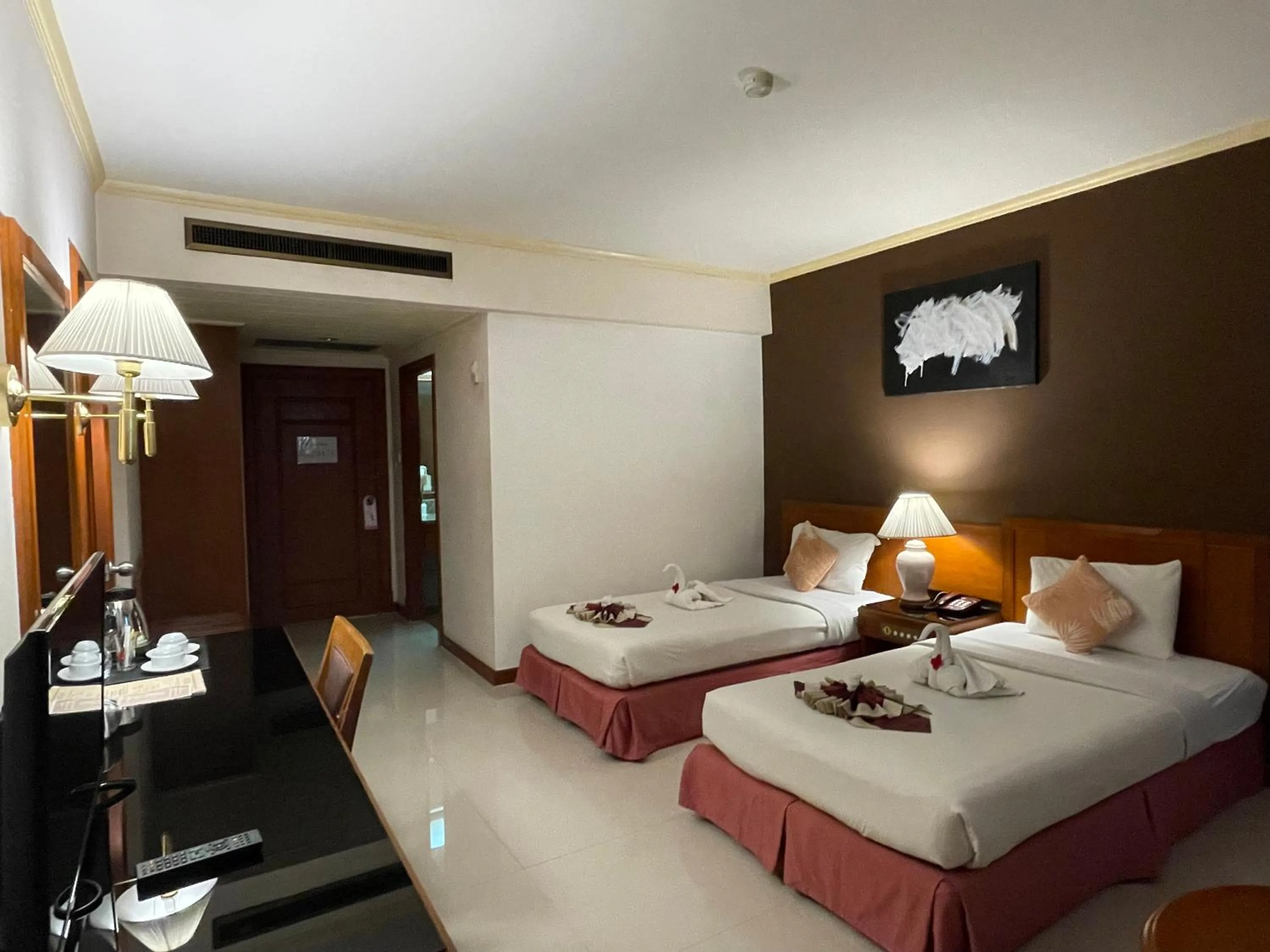 Bed in Songphanburi Hotel