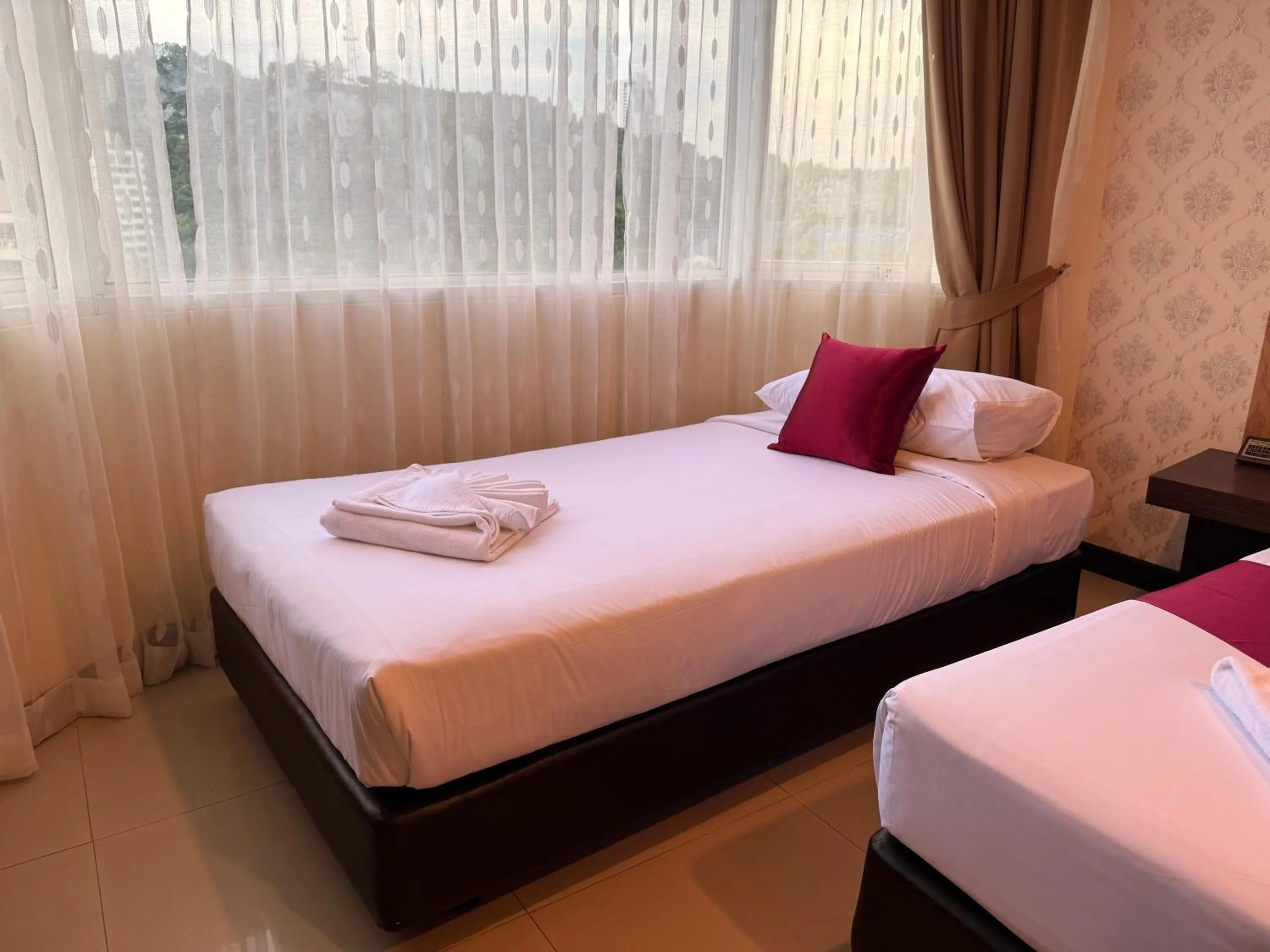 Bed in Suncity Hotel Pattaya