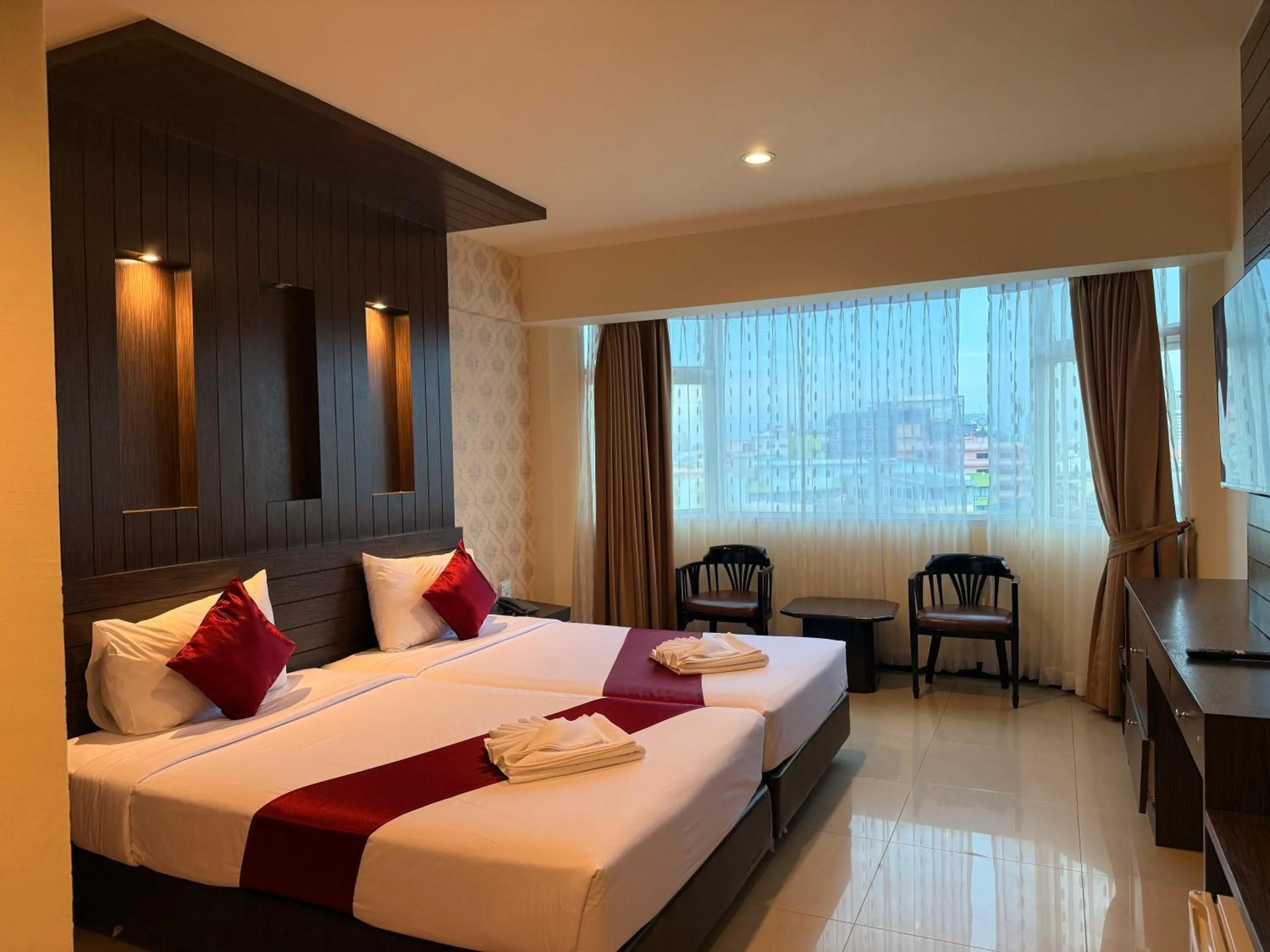 Bed in Suncity Hotel Pattaya