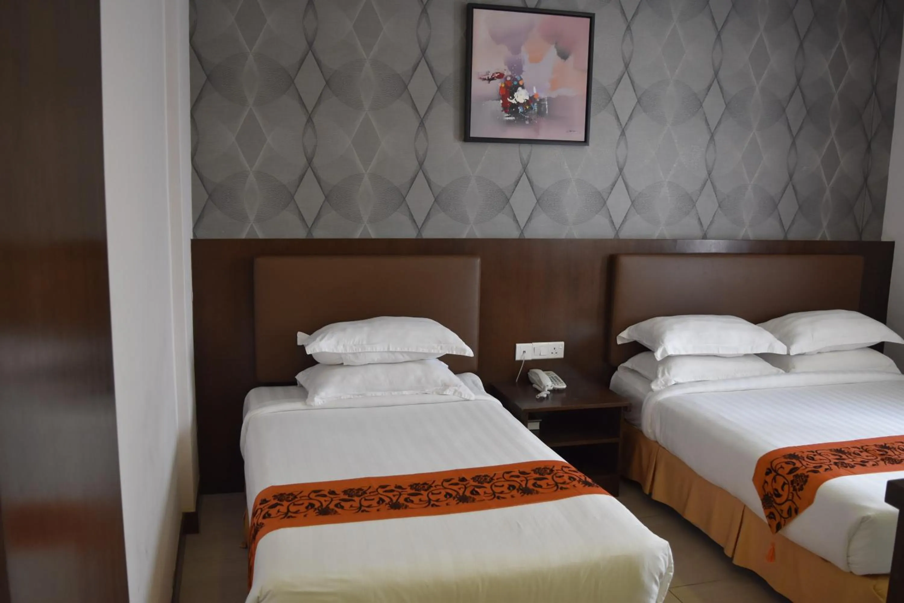 Bed in Sunrise Hotel