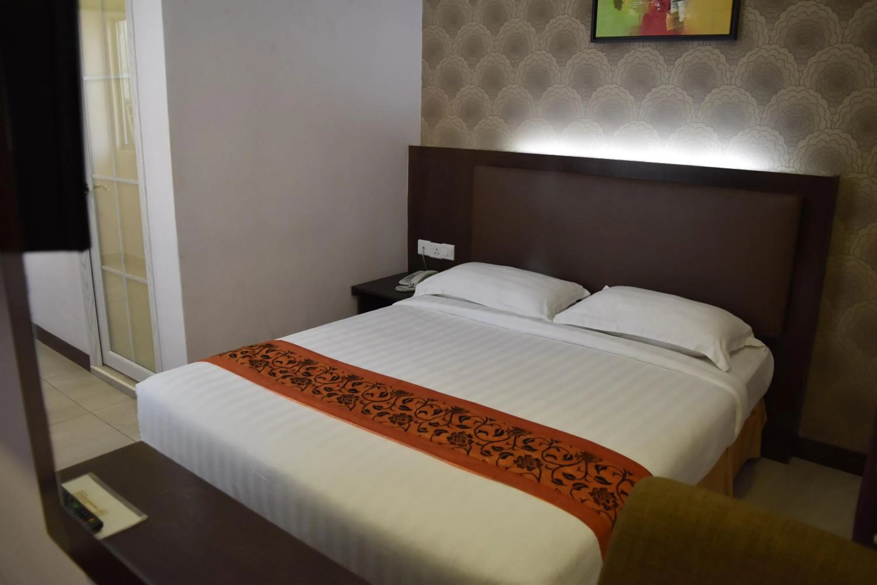 Bed in Sunrise Hotel