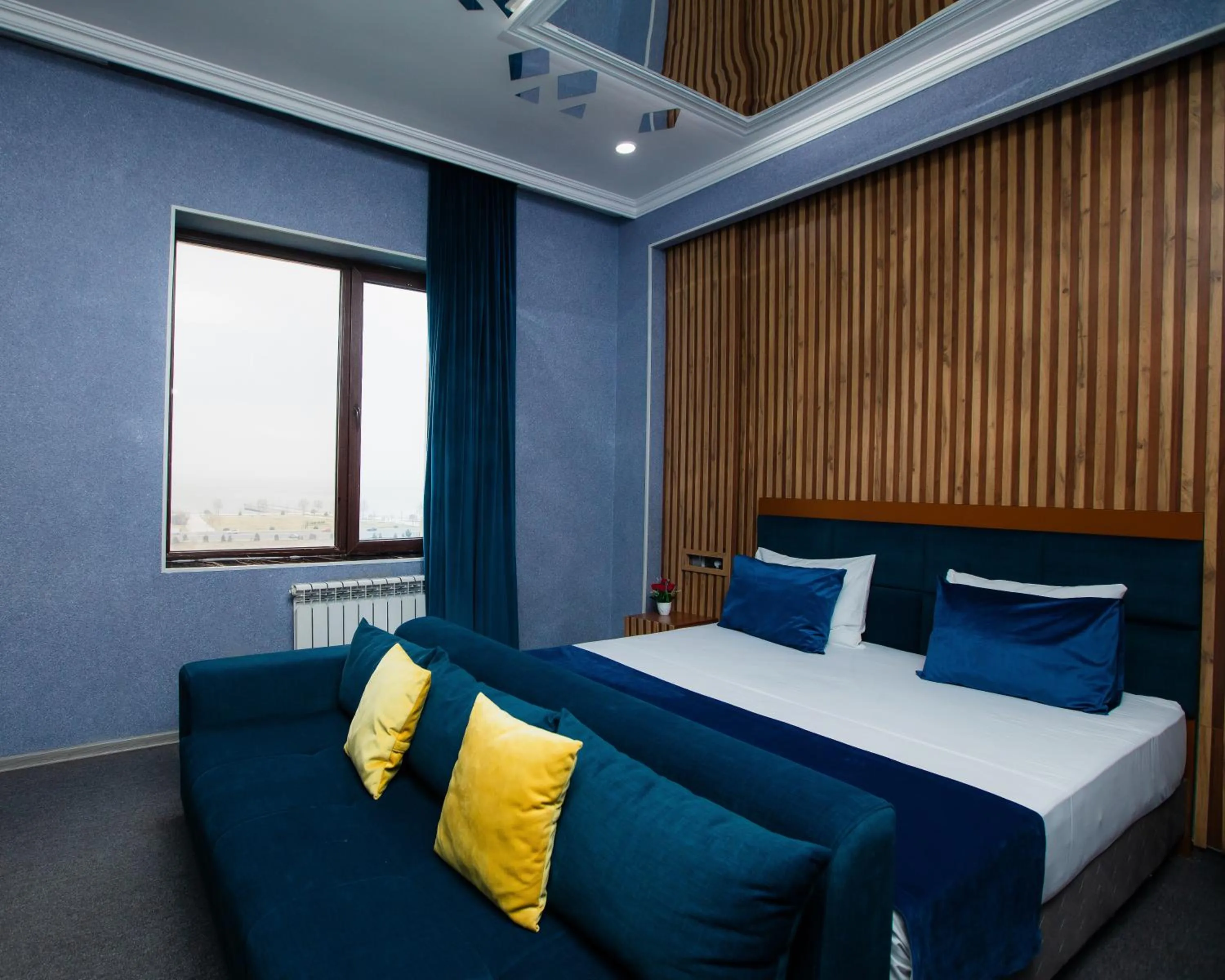 Bed in Corniche White City Hotel