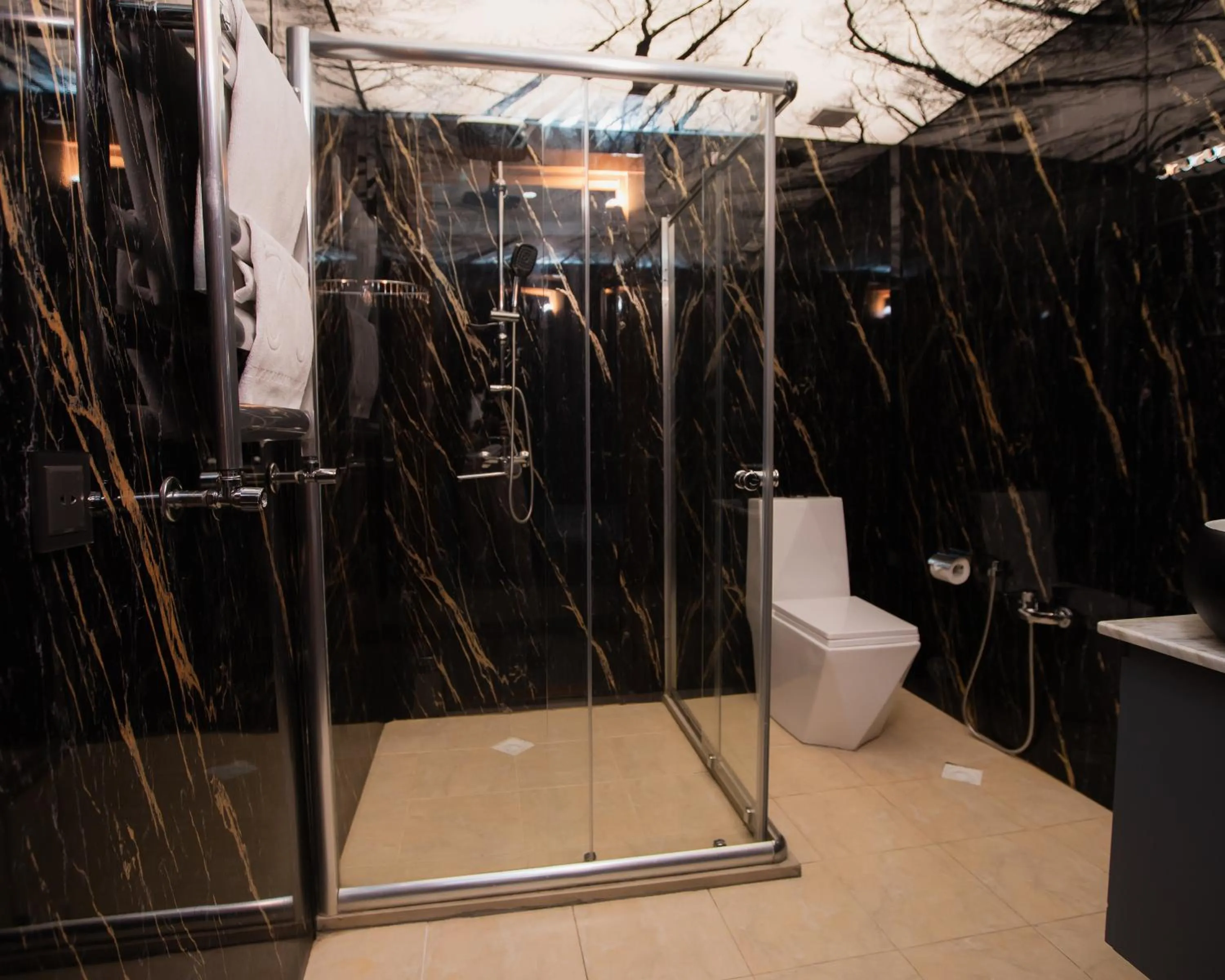 Shower in Corniche White City Hotel