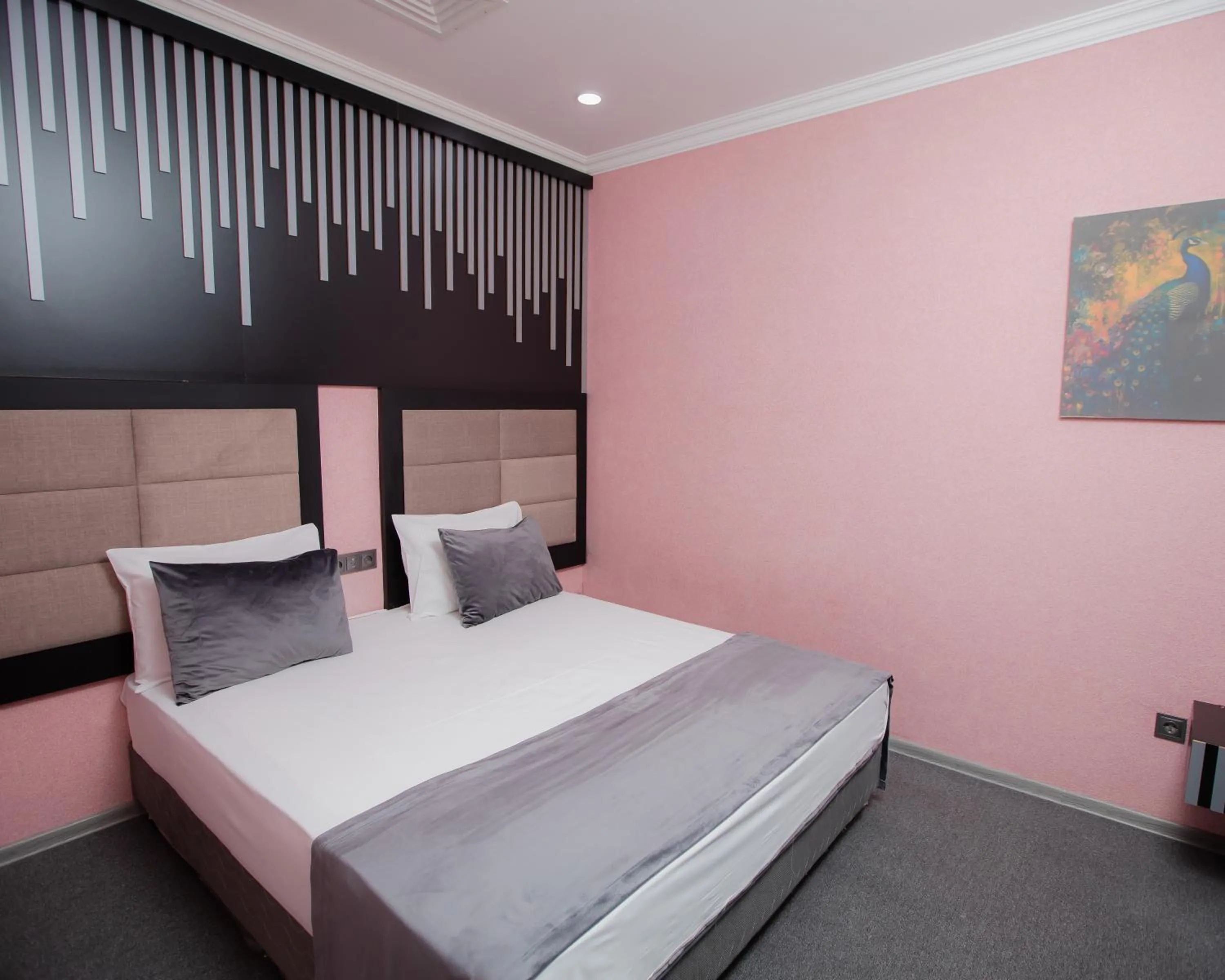 Bed in Corniche White City Hotel