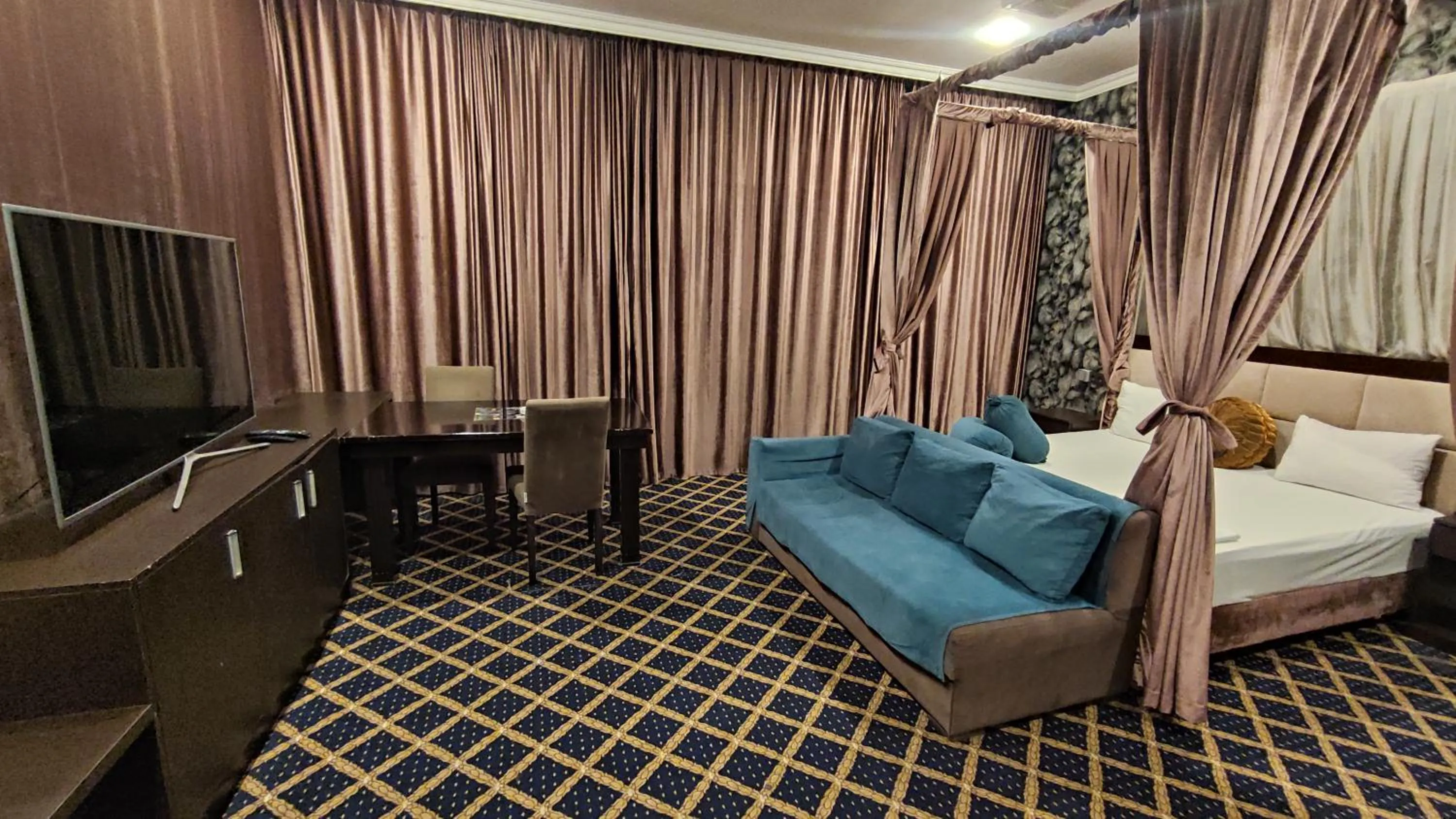 Bed in Corniche White City Hotel