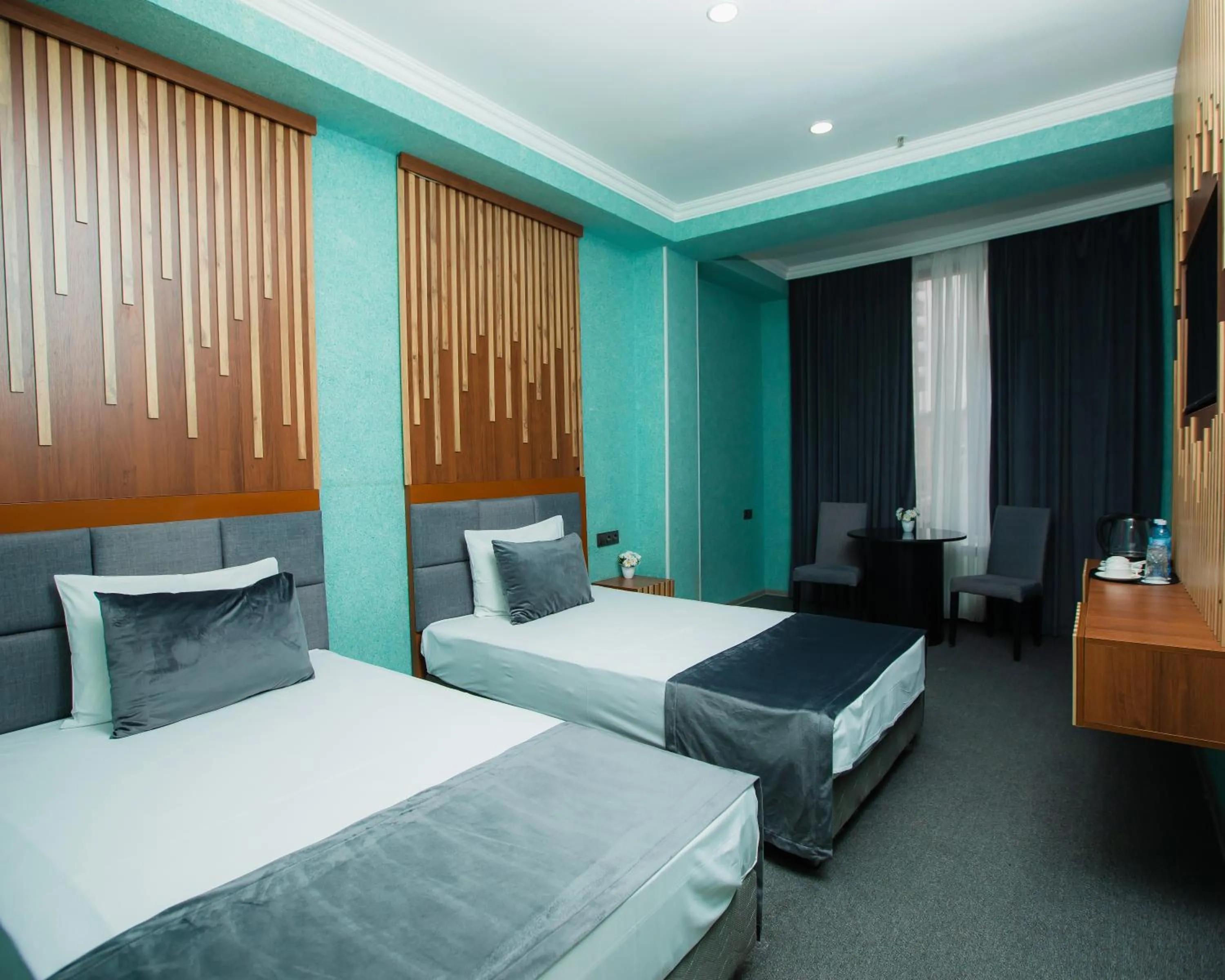 Bed in Corniche White City Hotel