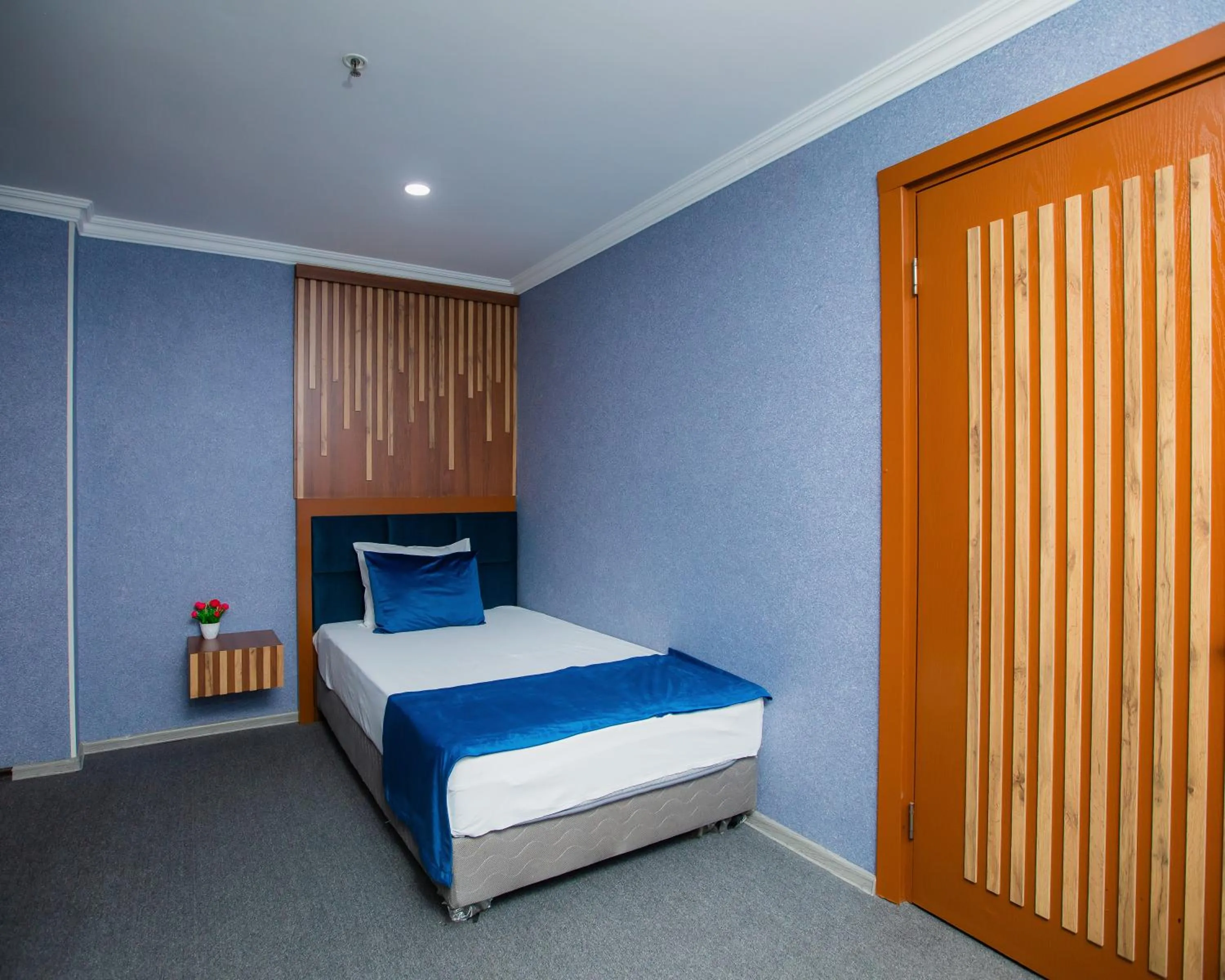 Bed in Corniche White City Hotel