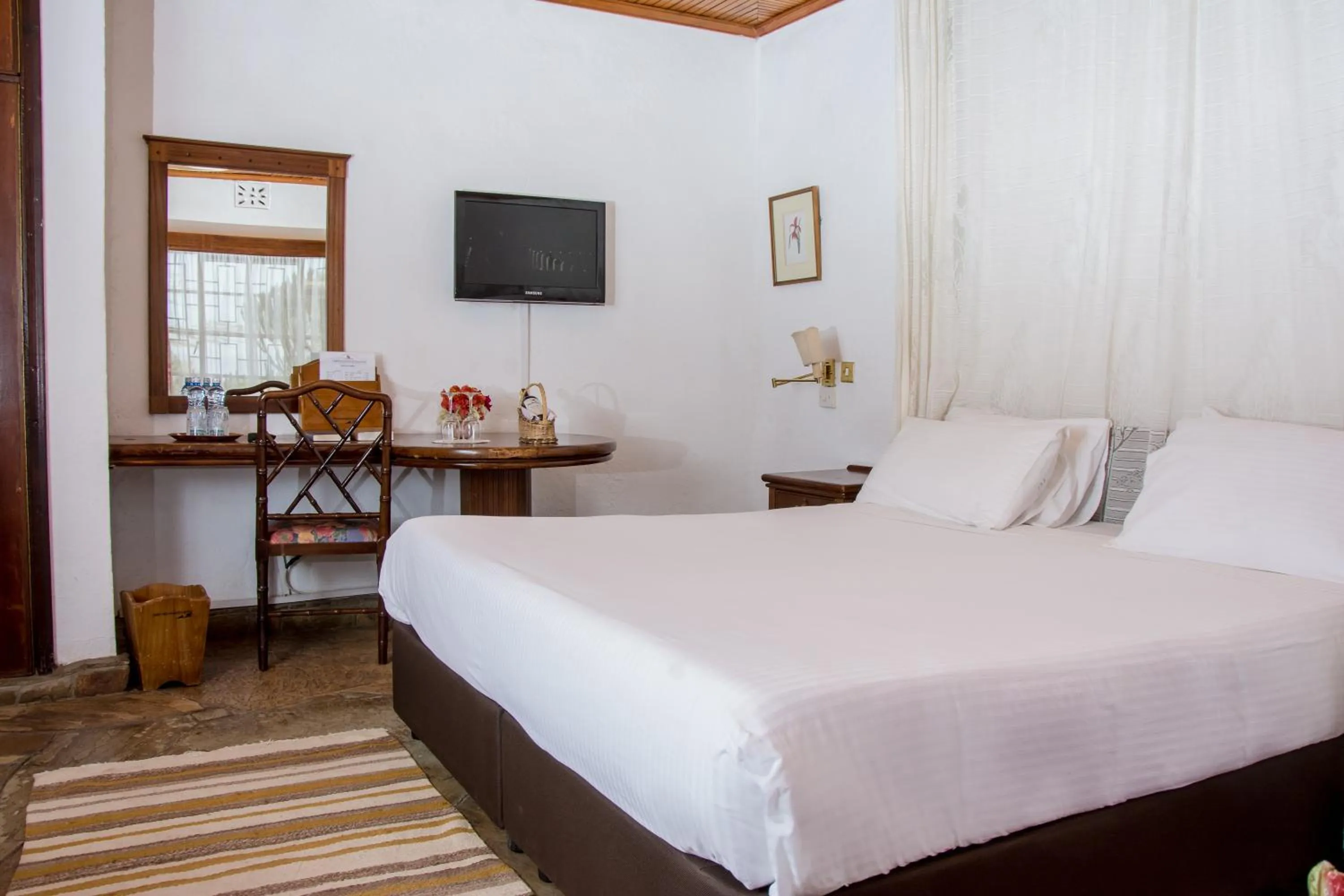 Bed in Jacaranda Lake Elementaita Lodge