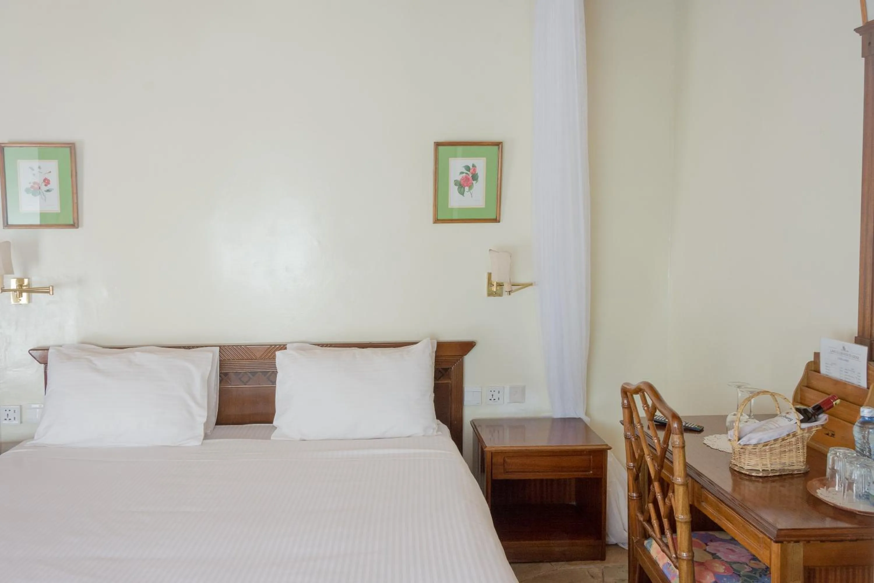 Bed in Jacaranda Lake Elementaita Lodge