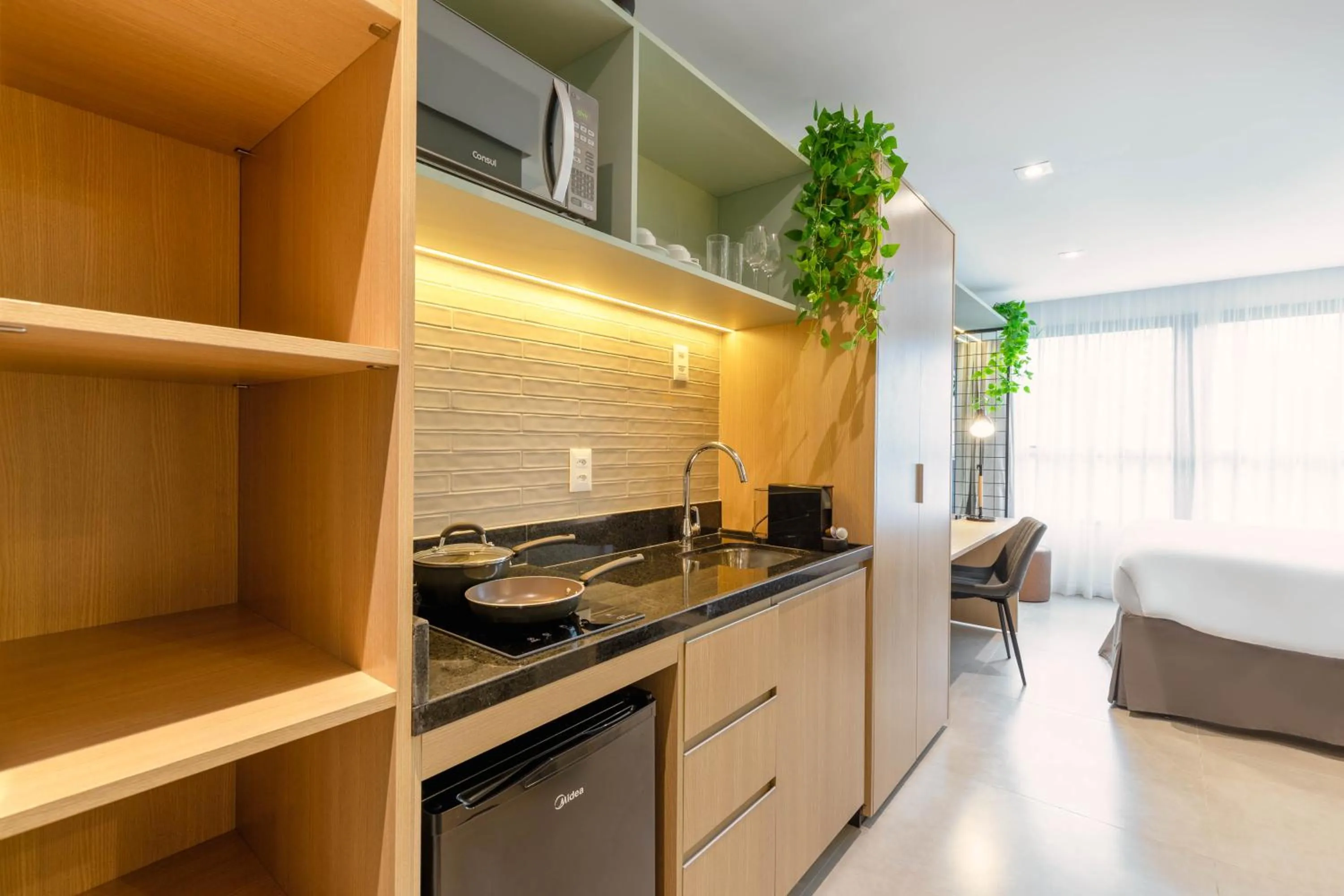 Kitchen or kitchenette in Cozzy Premium Paulista Hotel