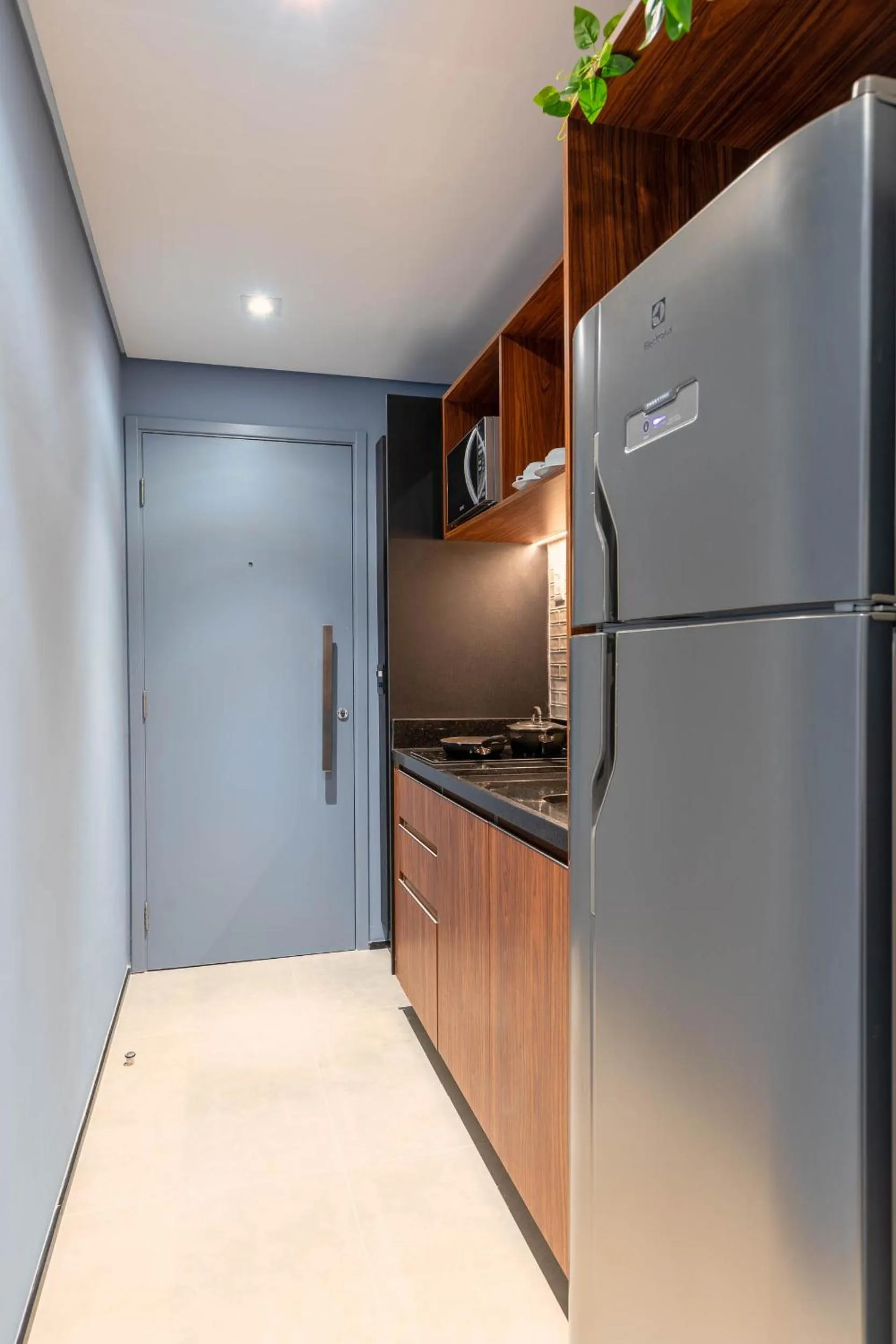 Kitchen or kitchenette in Cozzy Premium Paulista Hotel