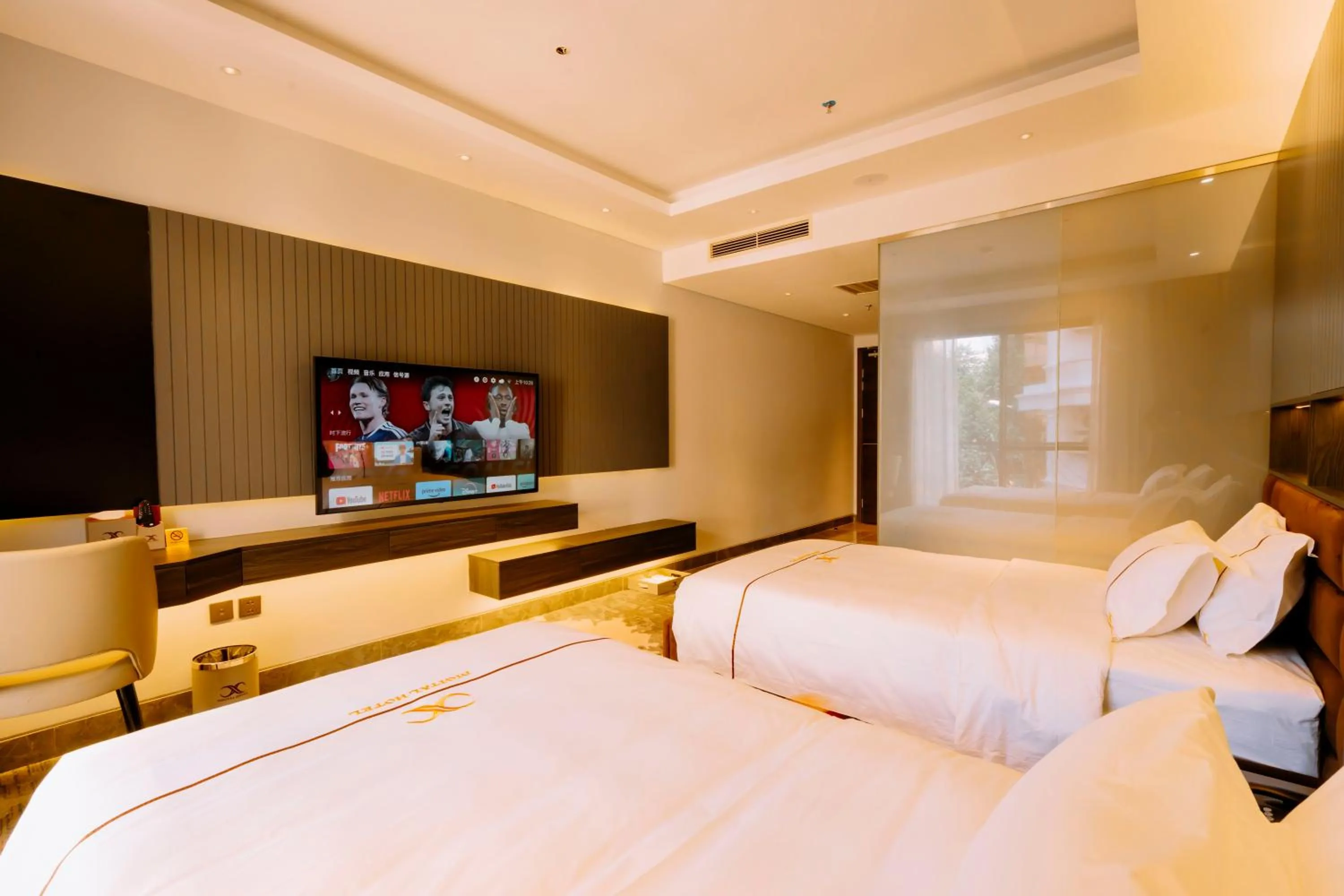 Bed in X-Digital HOTEL