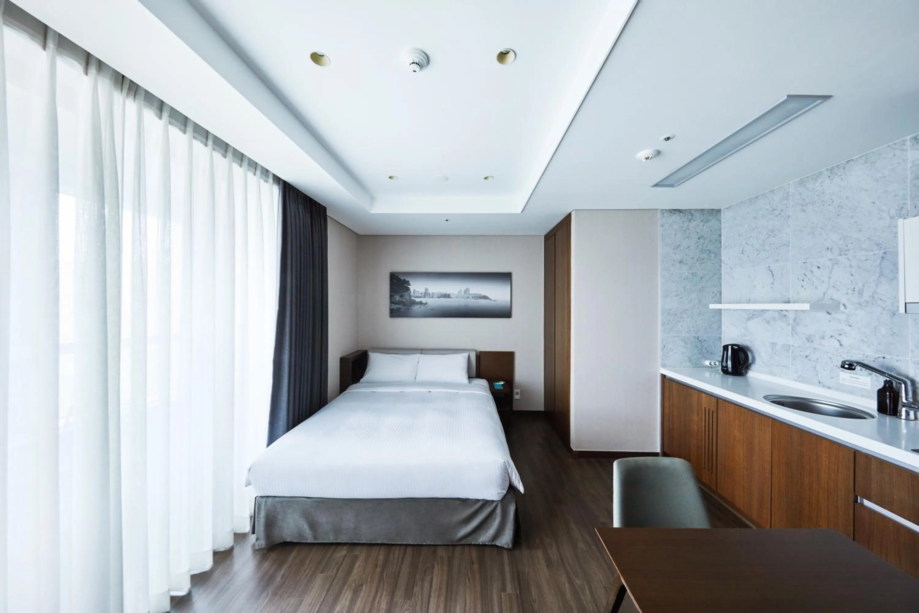 Bed in Felix by STX Hotel & Suite