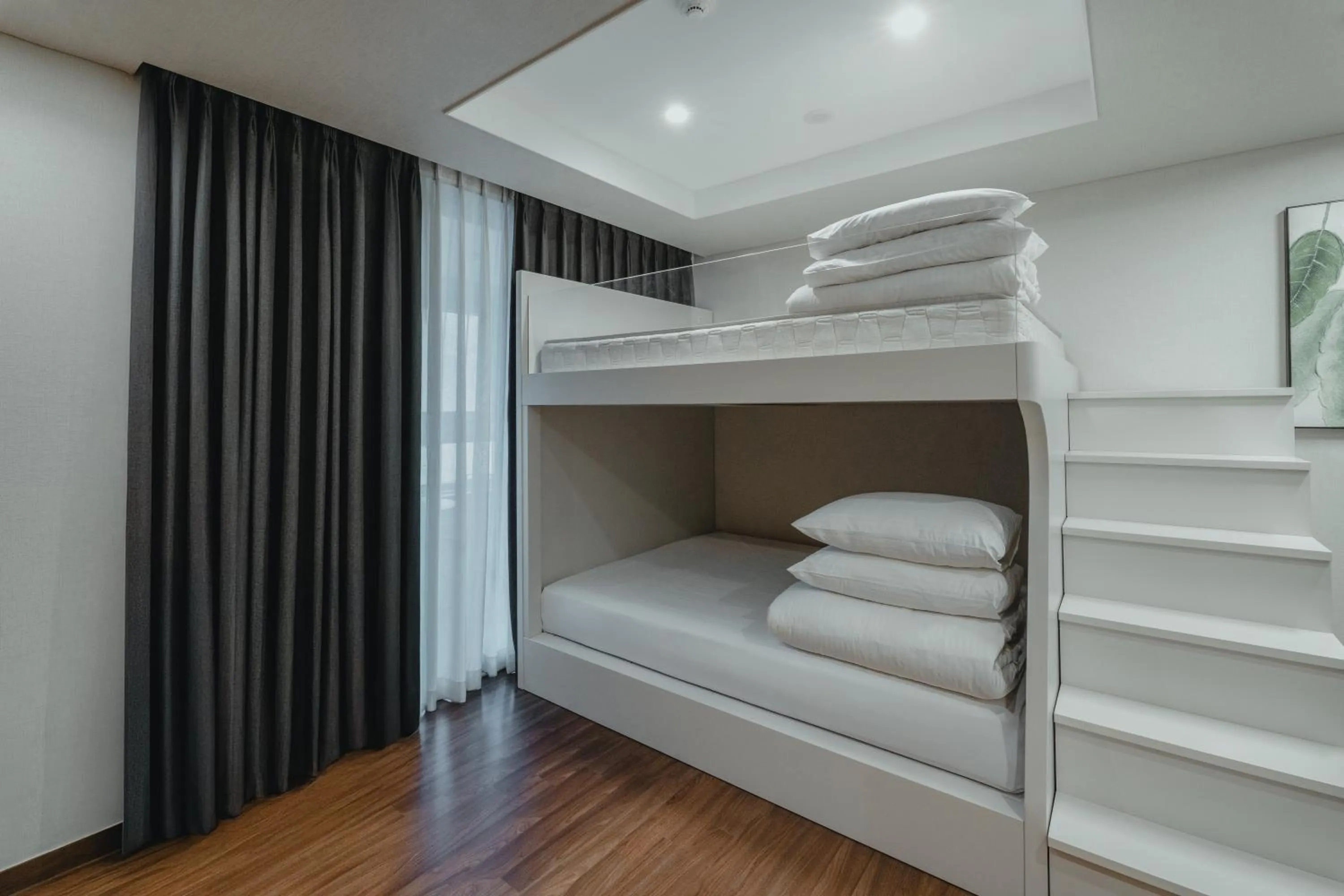 Bed in Felix by STX Hotel & Suite