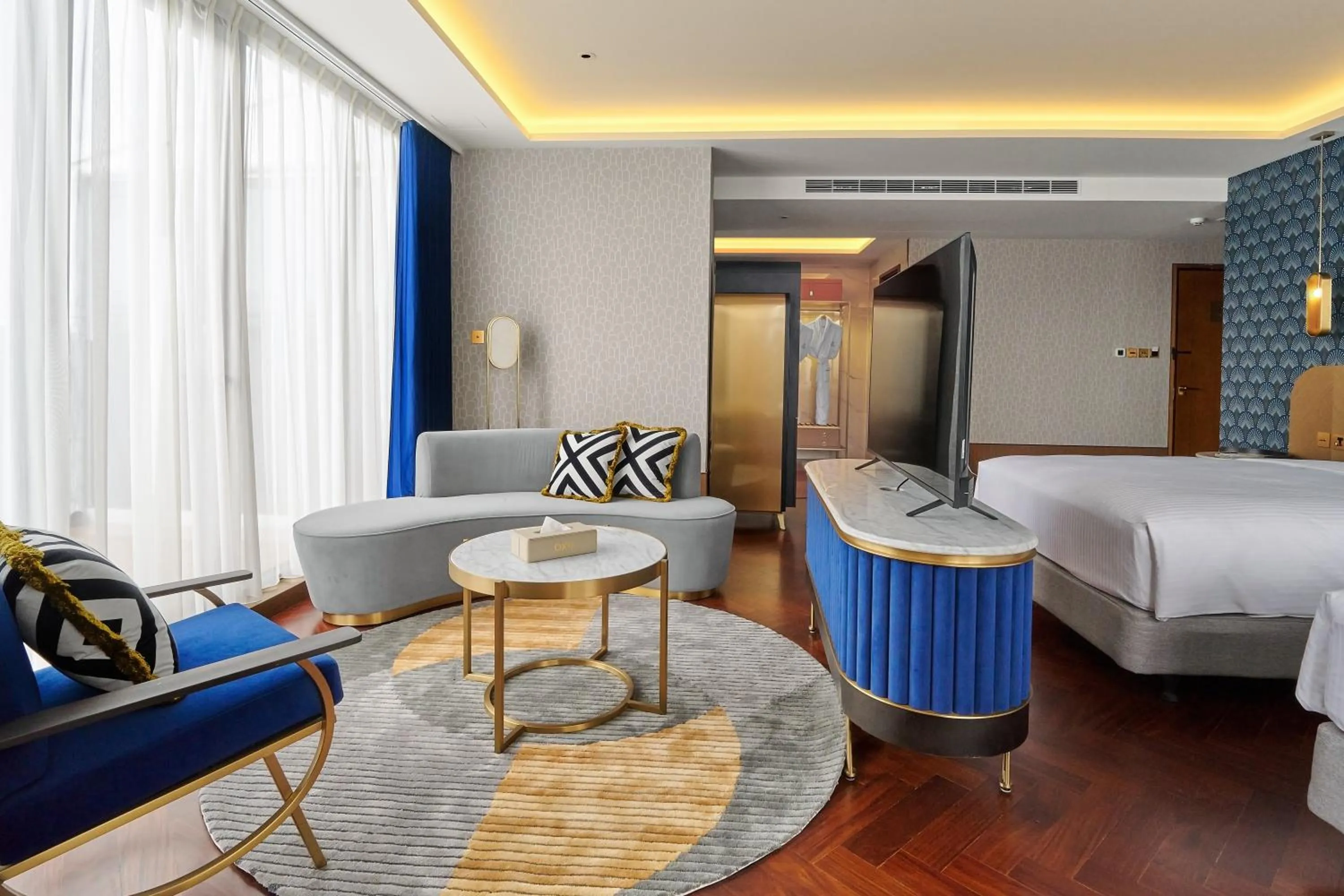 Living room, Bed in OKU Hotel