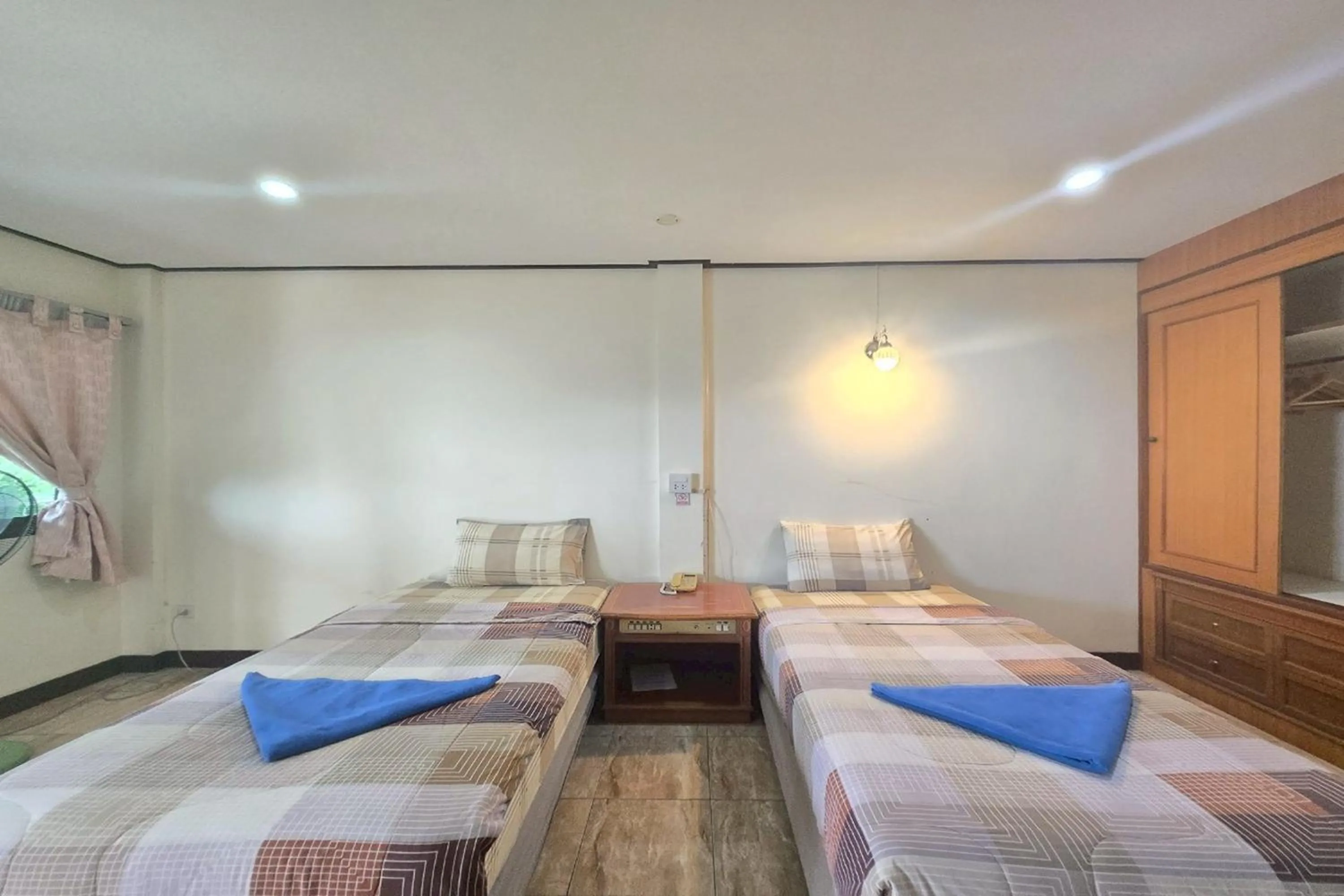 Bed in Phaiboon Hotel & Resort