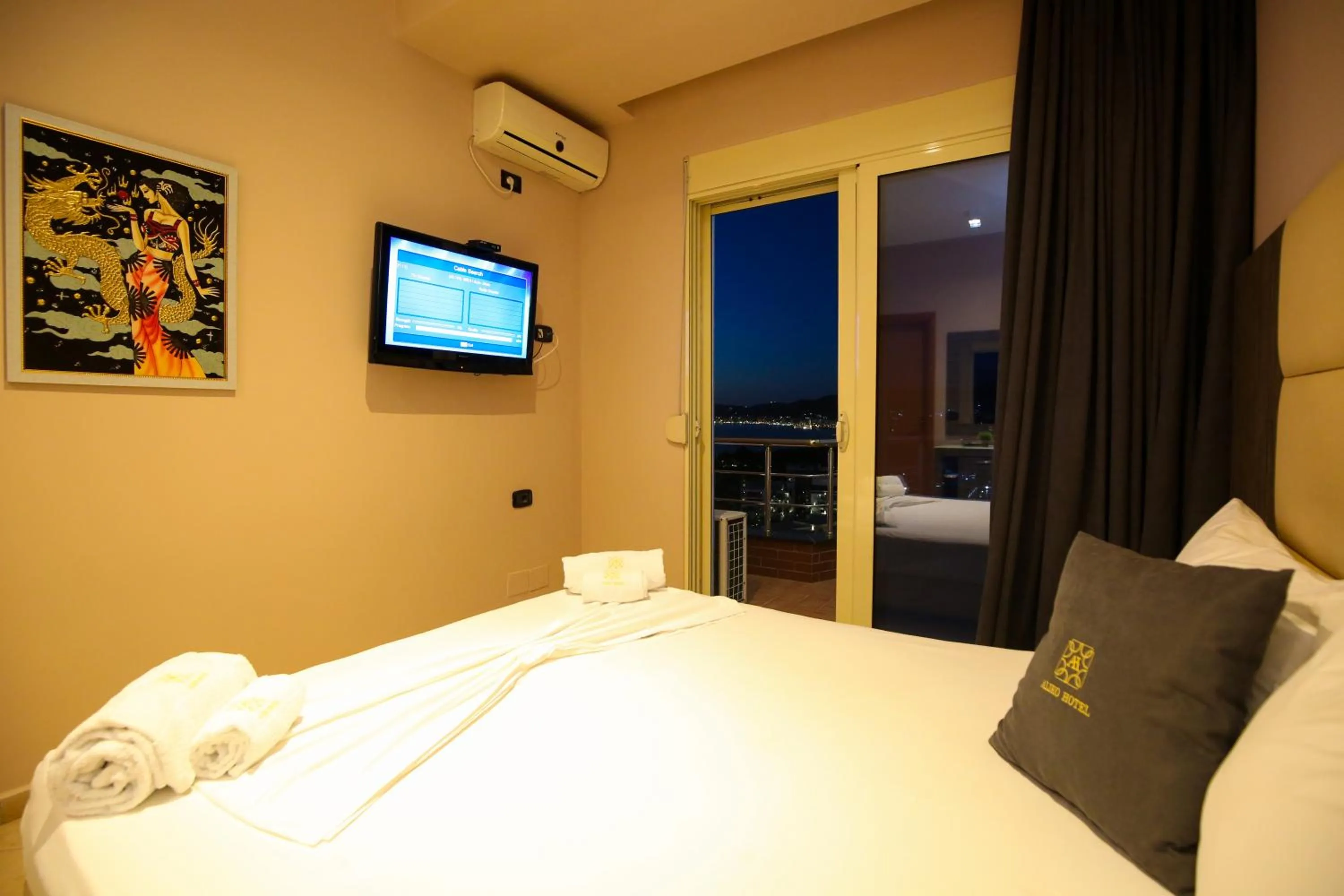 Communal lounge/ TV room in Aliko Hotel