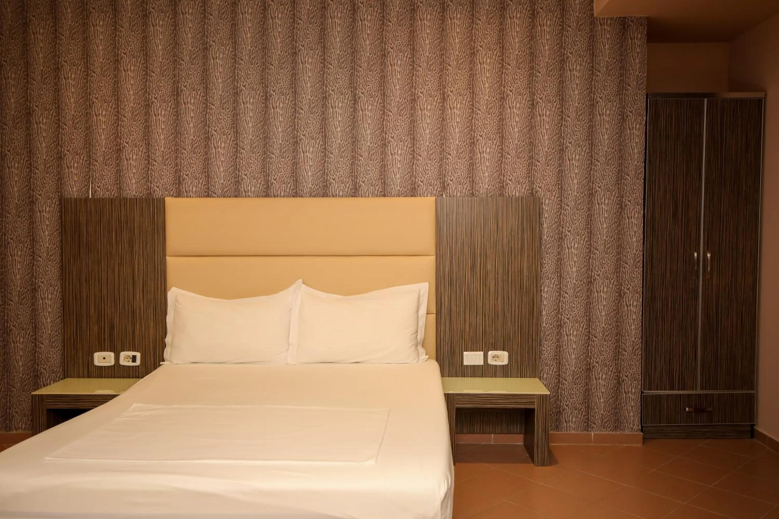 Bed in Aliko Hotel