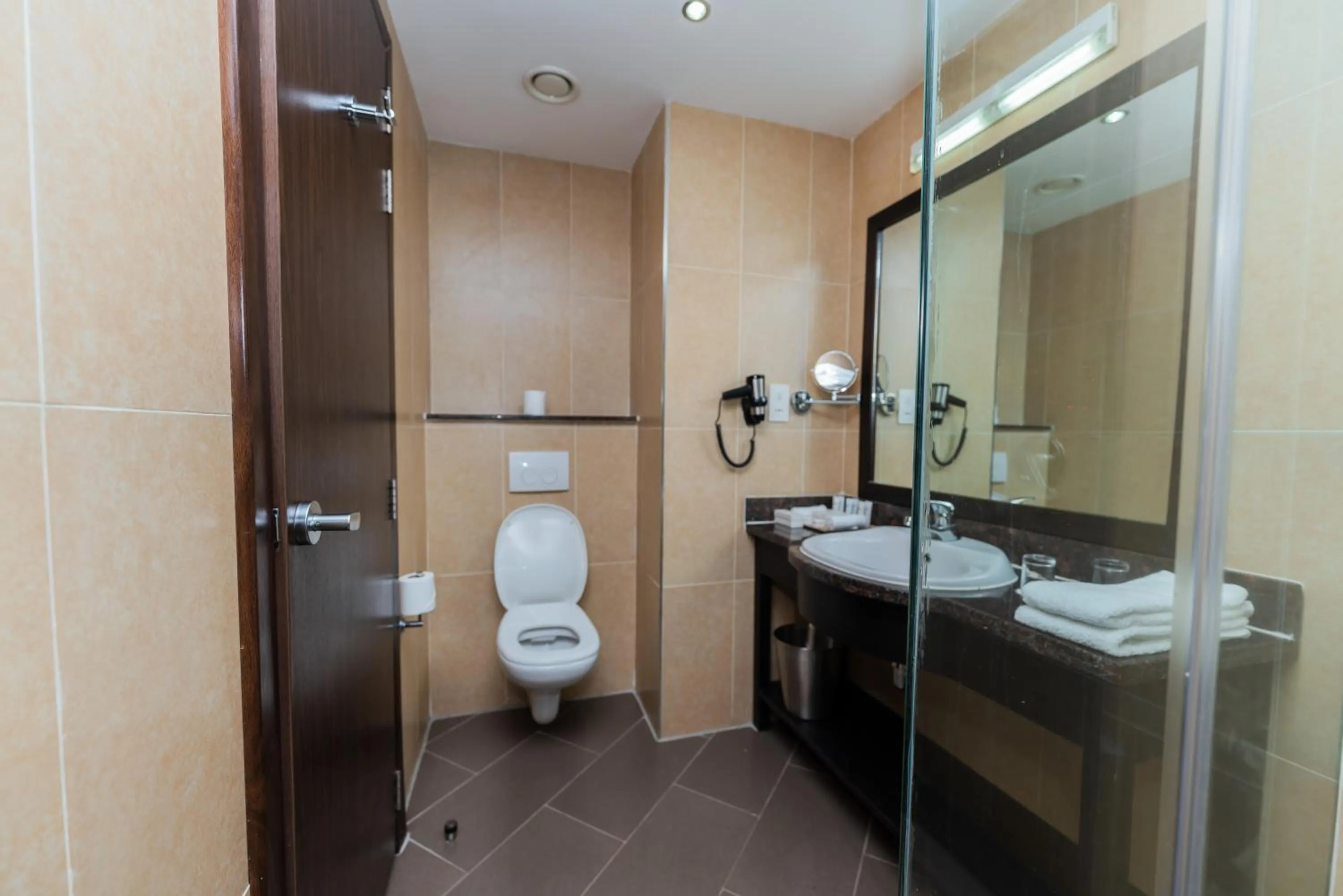 Toilet in Acacia Premier Hotel