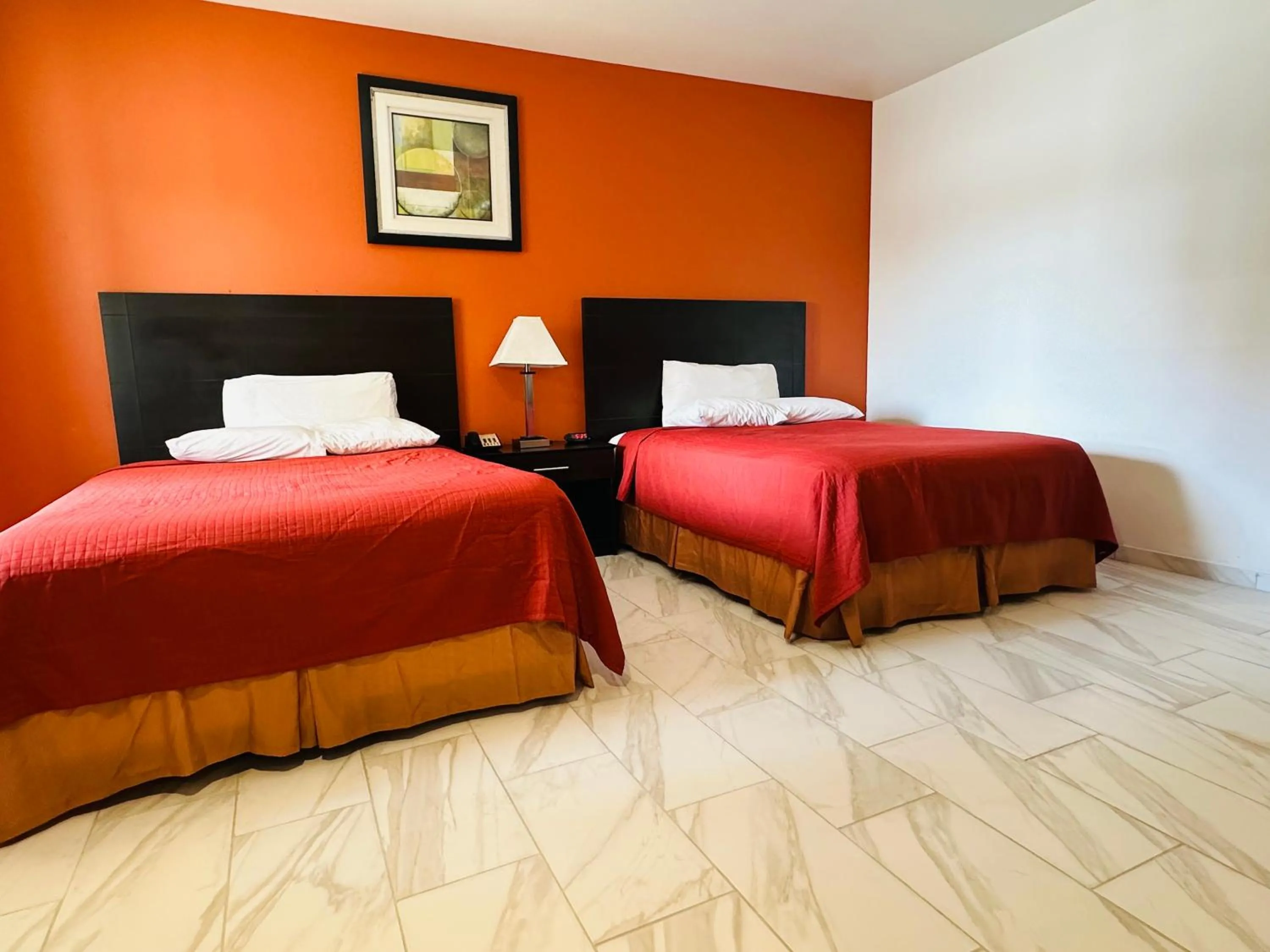 Bed in Lux Inn and Suites