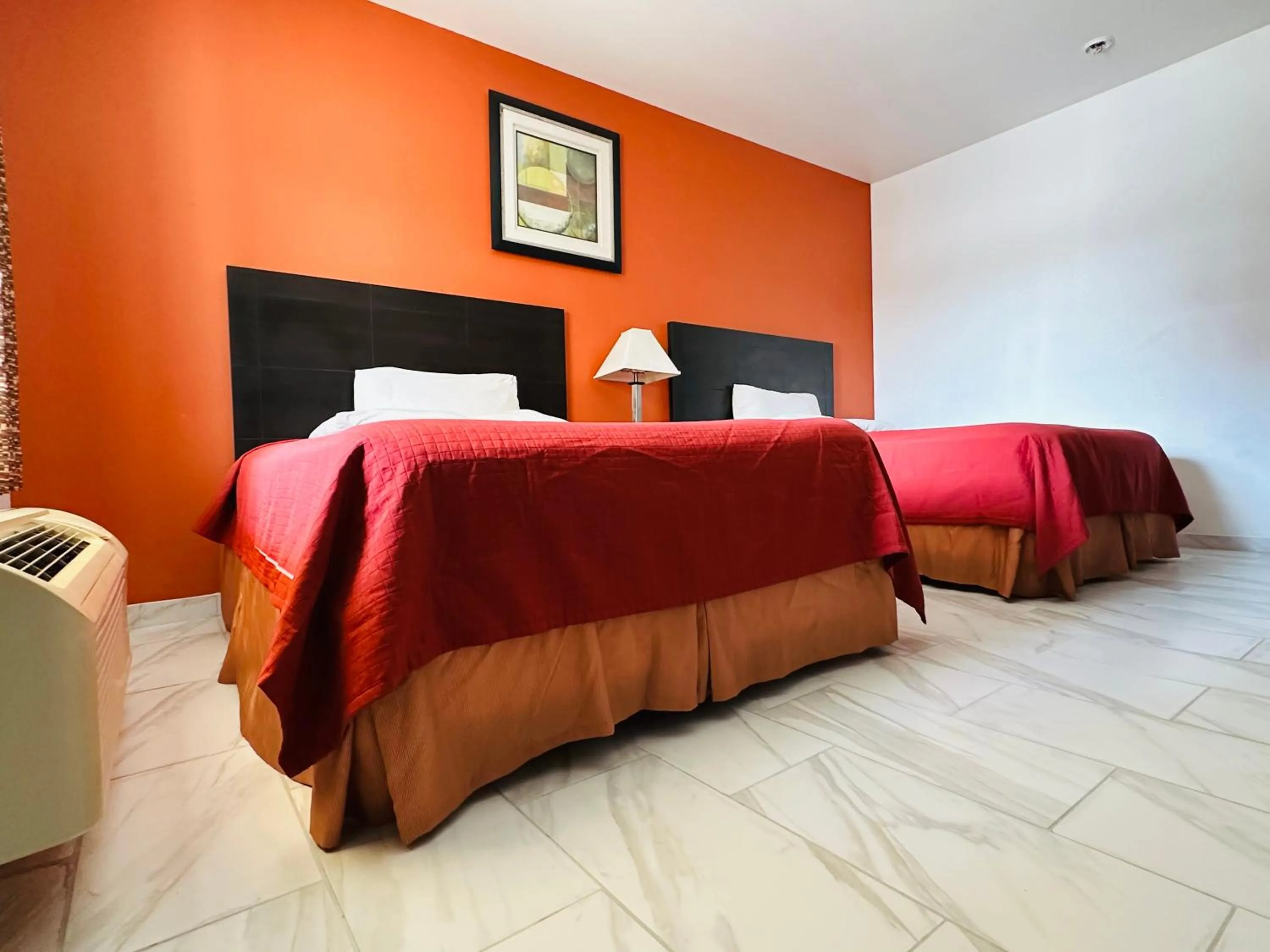 Bed in Lux Inn and Suites