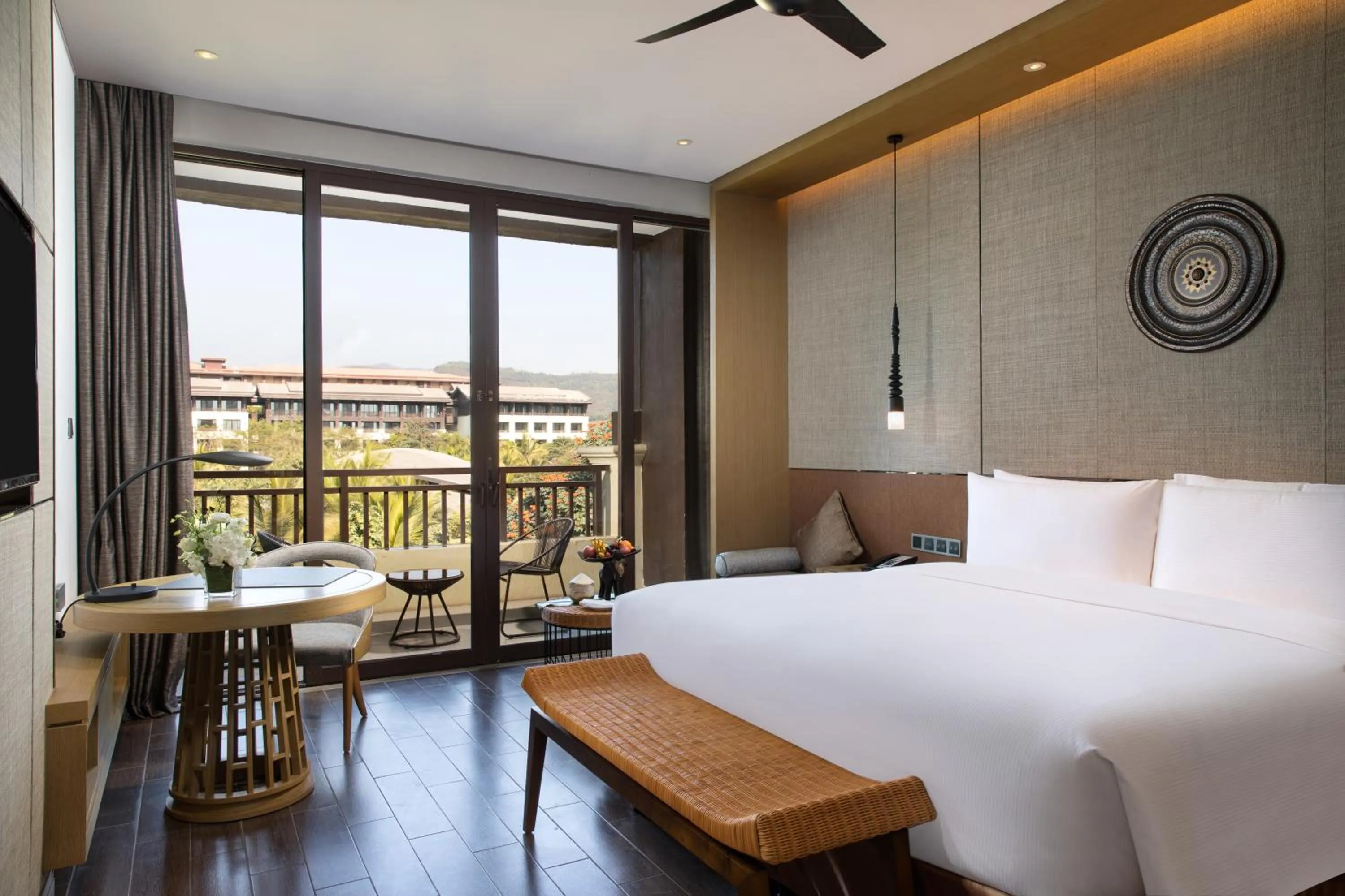 Photo of the whole room, Bed in Pullman Resort Xishuangbanna