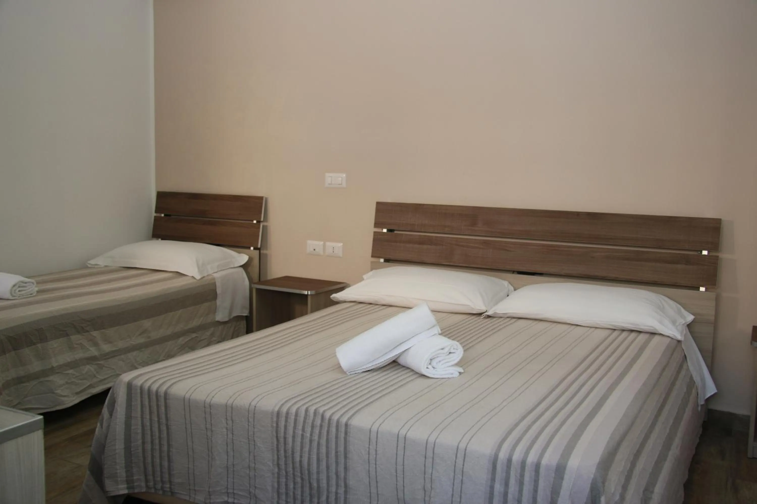 Bed in ChrisMare Hotel