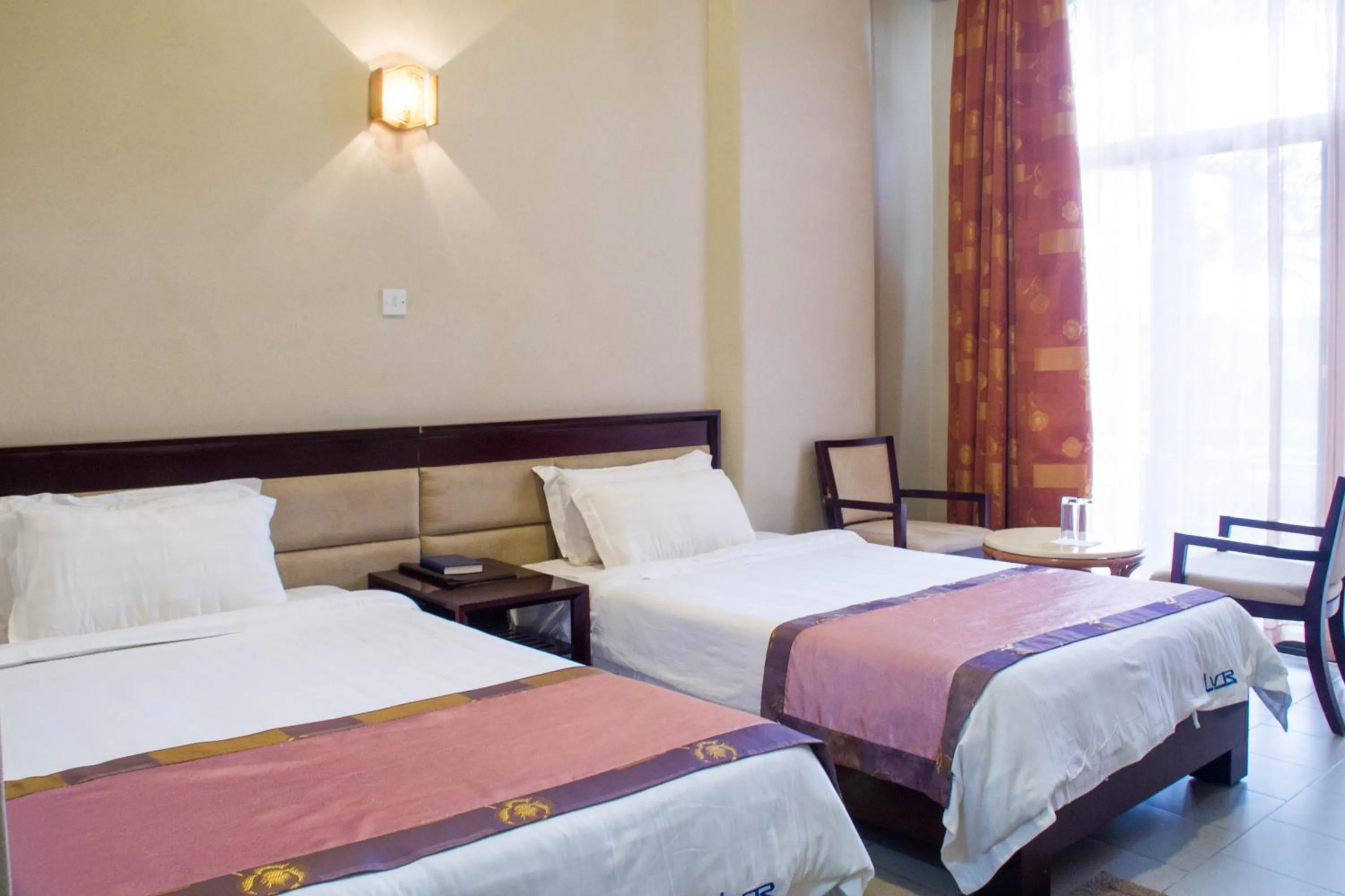 Bed in Lake View Resort Hotel