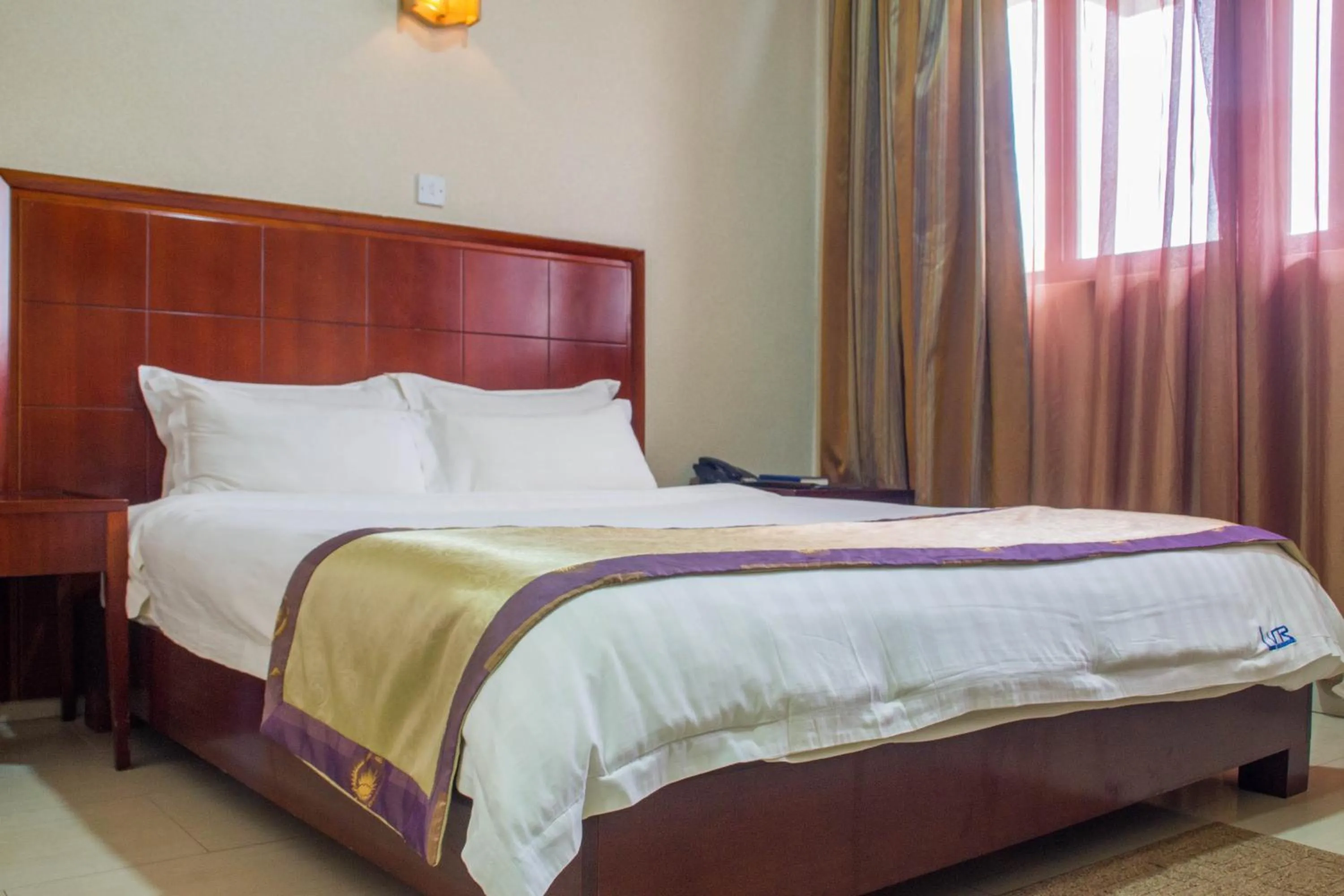 Bed in Lake View Resort Hotel