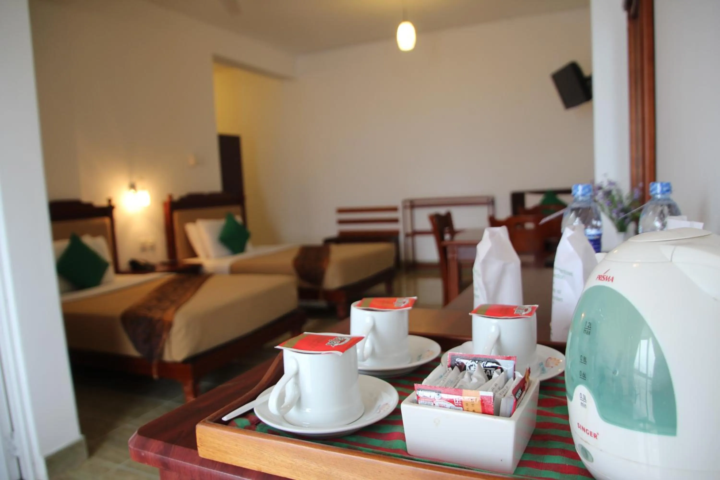Coffee/tea facilities, Bed in Olympus Plaza Hotel