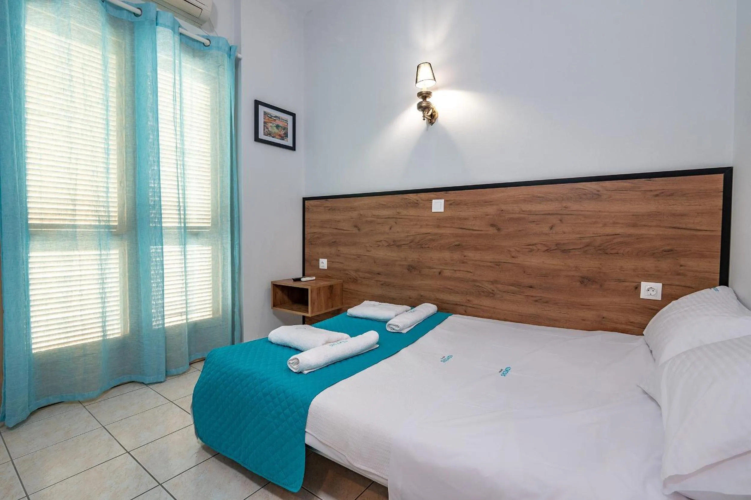 Bed in Genesis Hotel